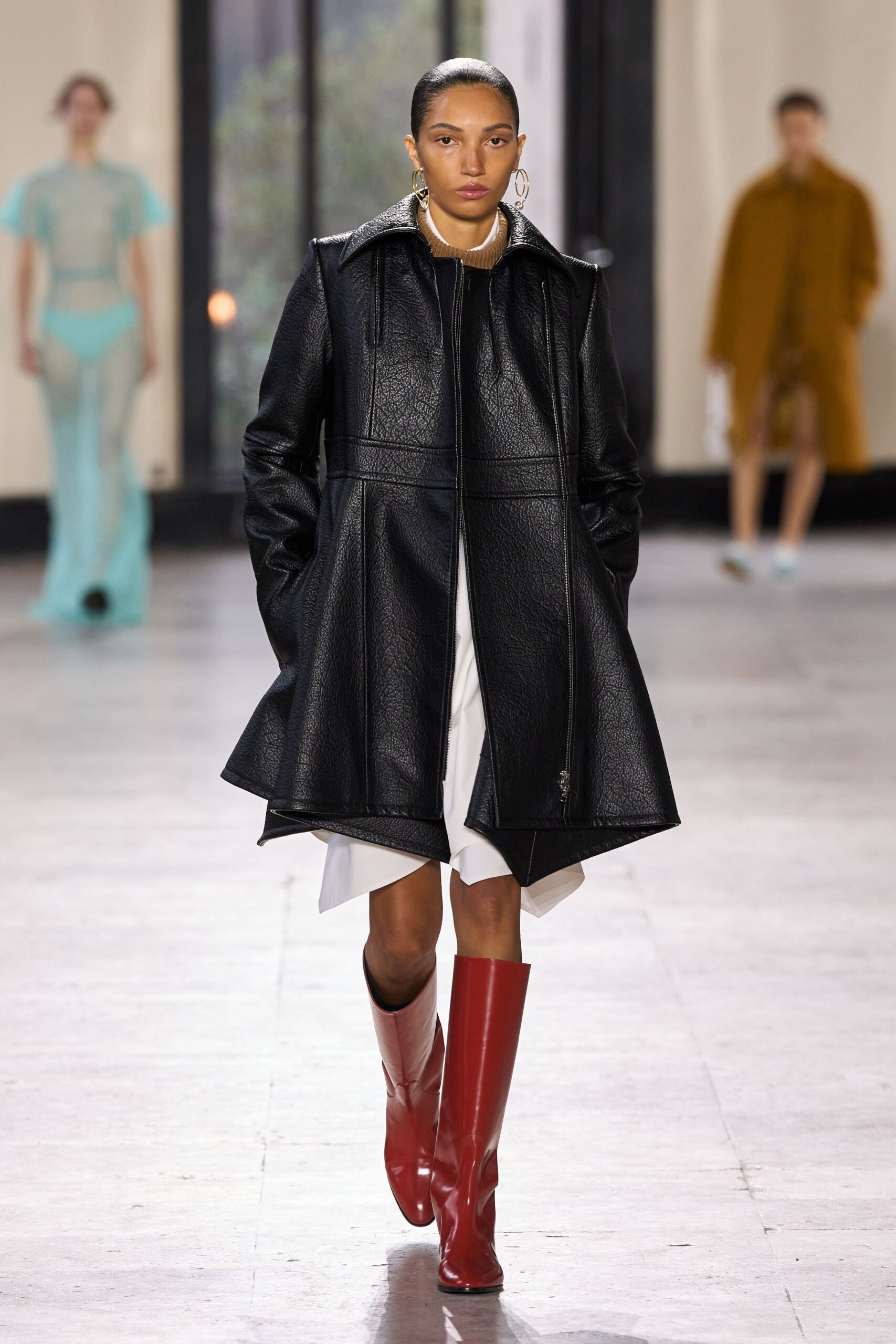 black leather long-sleeve collared fitted zippered flared coat