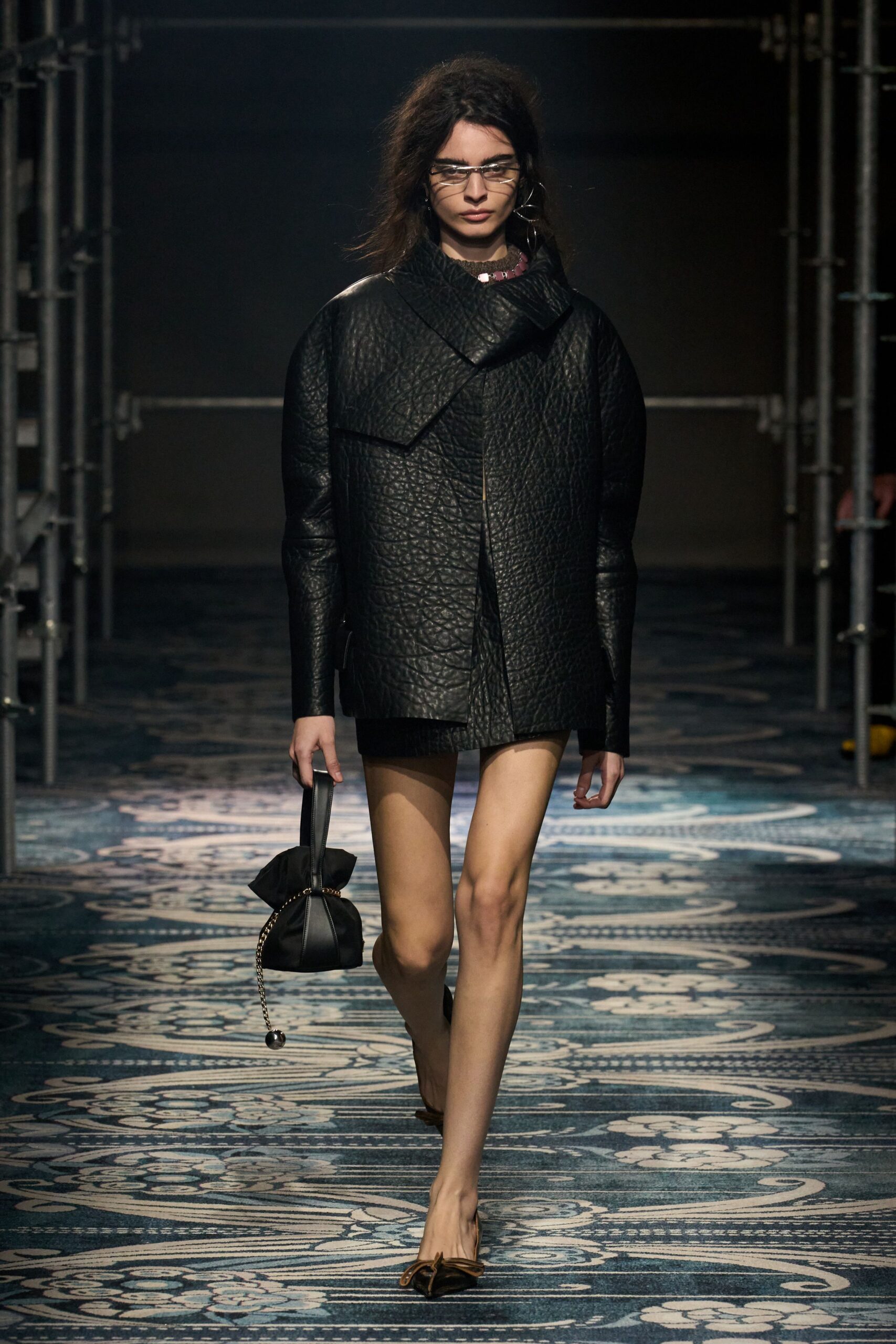 black leather long-sleeve collared fitted textured jacket