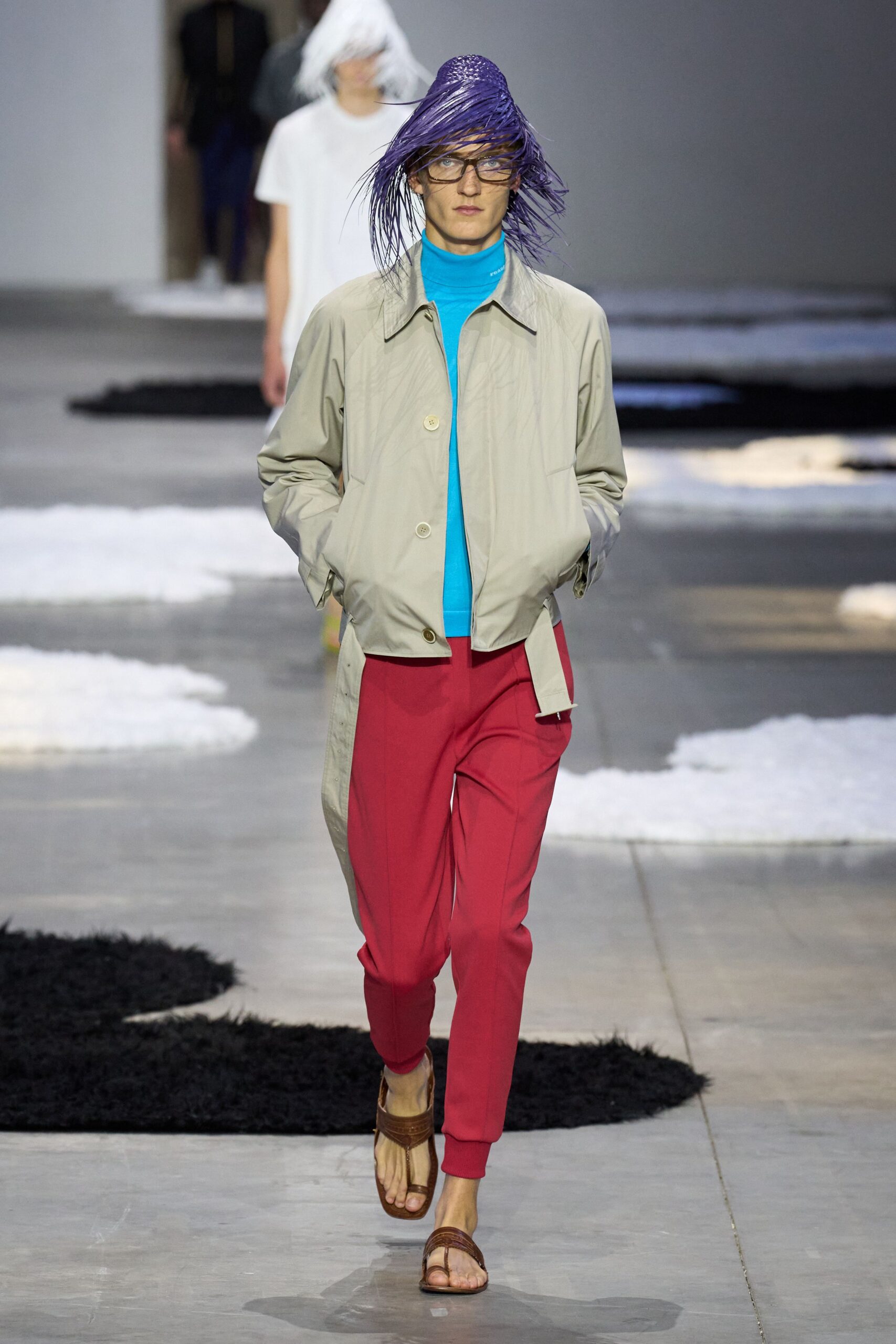 beige jacket blue top red pants
