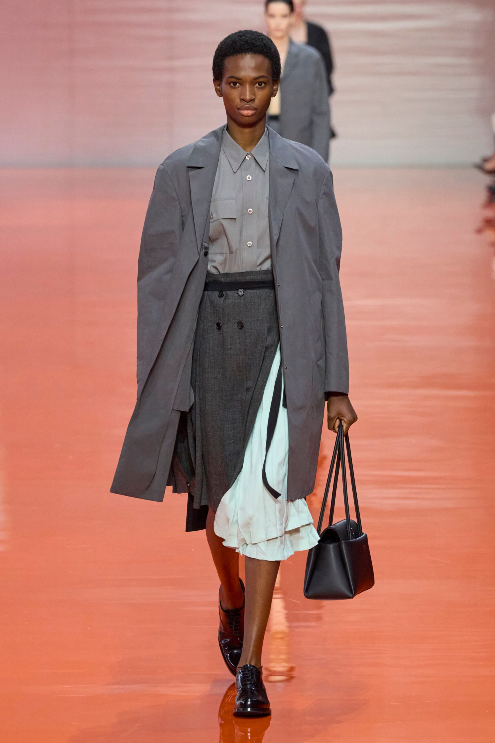 gray coat with black skirt