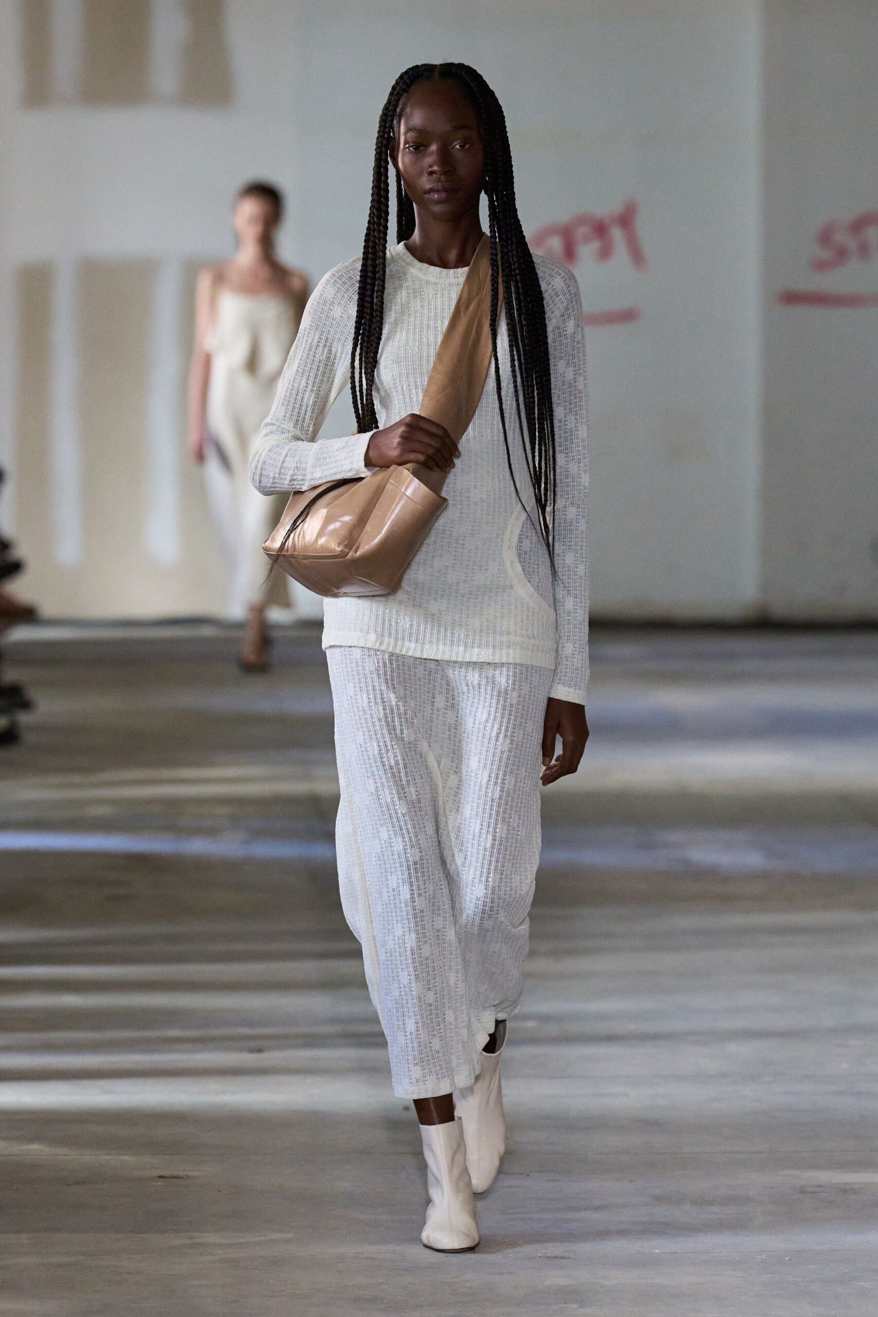 white ribbed midi dress with gold bag
