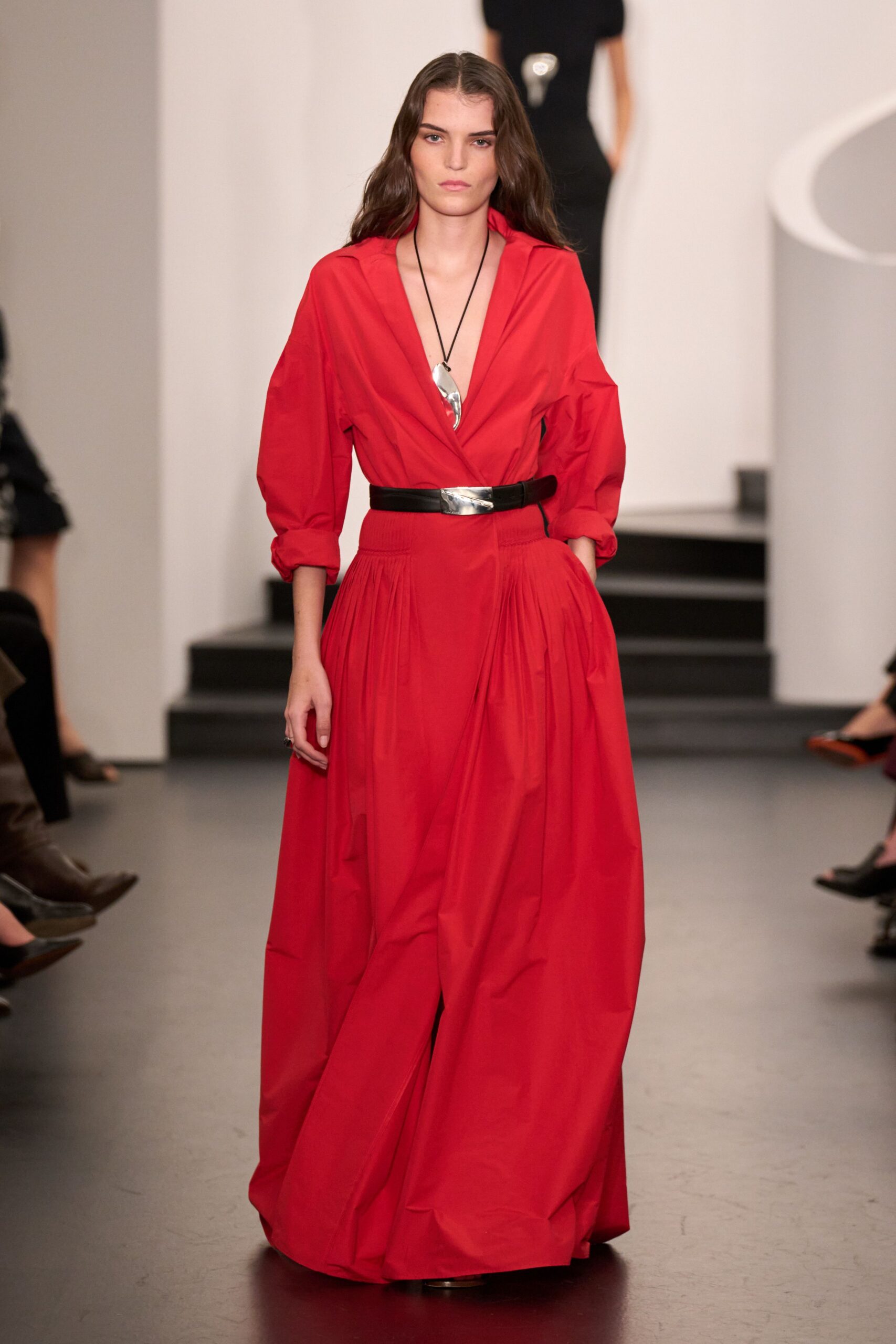 red cotton long-sleeve v-neck fitted pleated belted gown