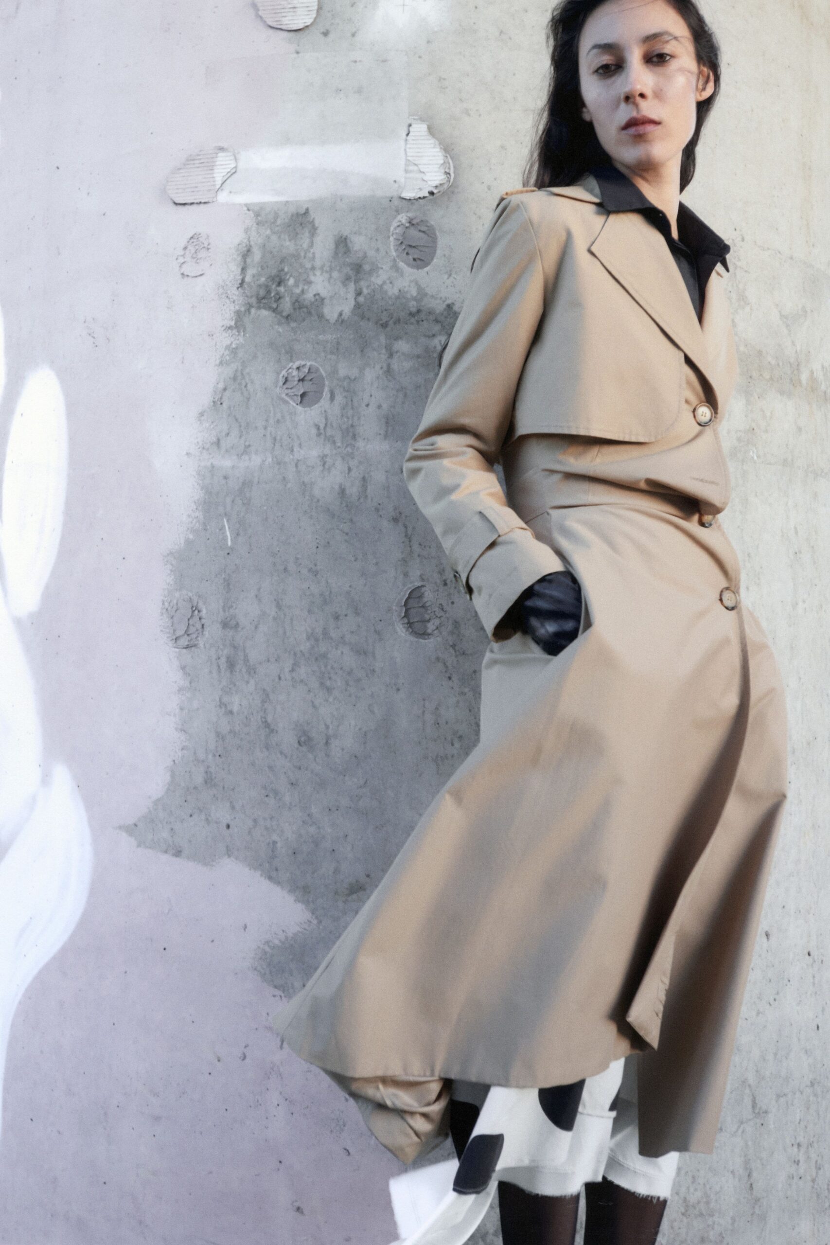 beige trench coat and pleated skirt