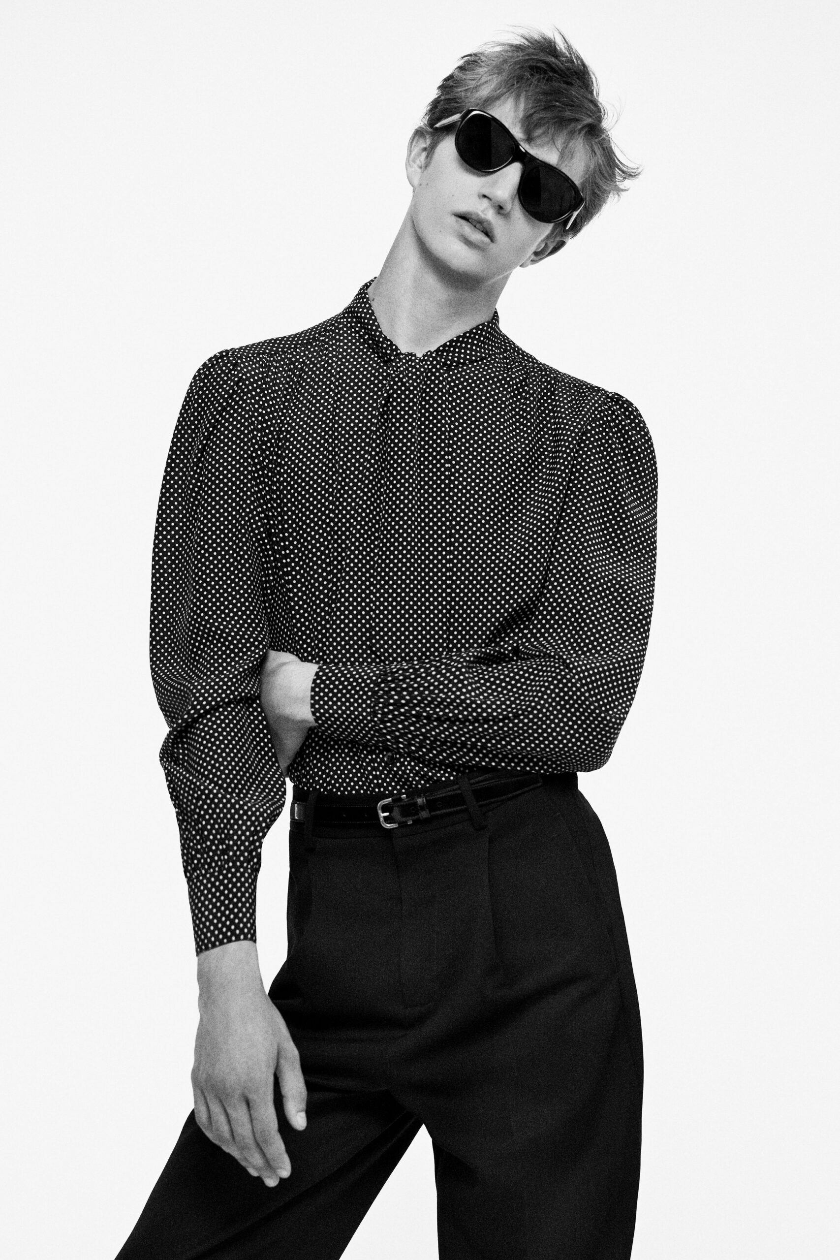 black and white polka-dot shirt with tailored pants