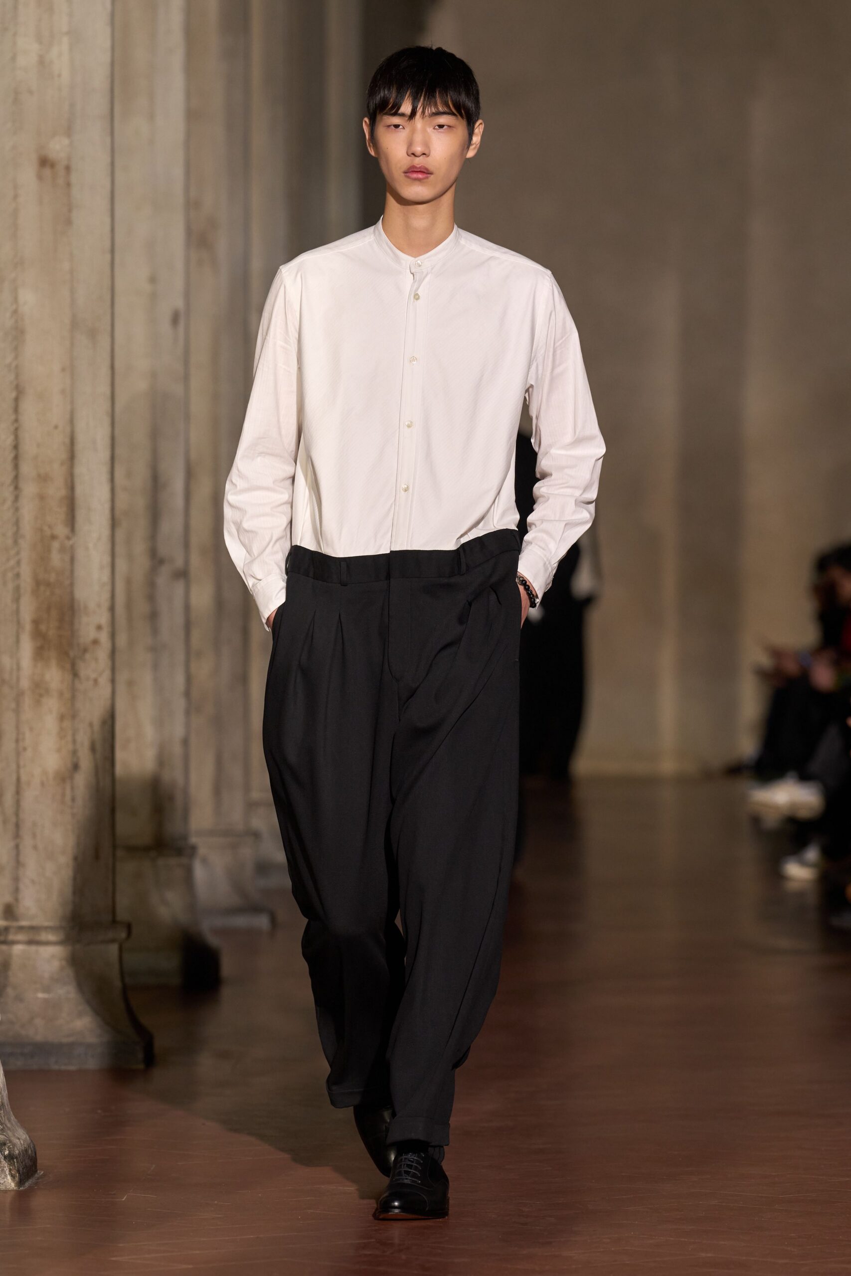 white relaxed shirt black pants