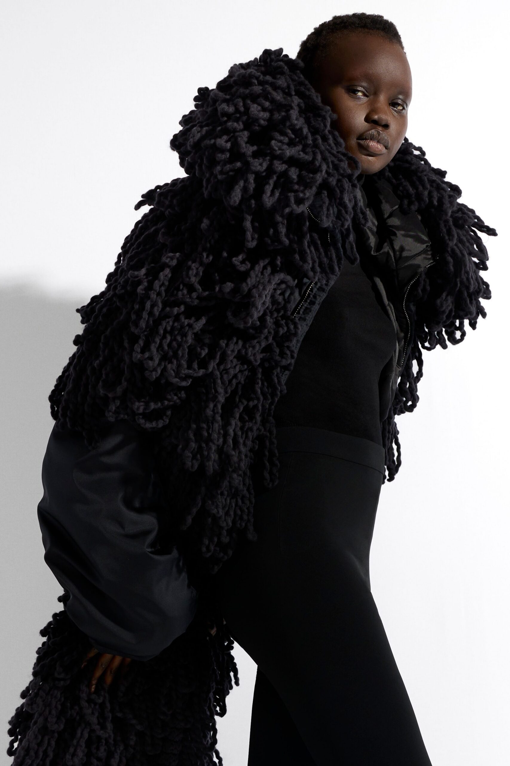 black relaxed coat with fringes