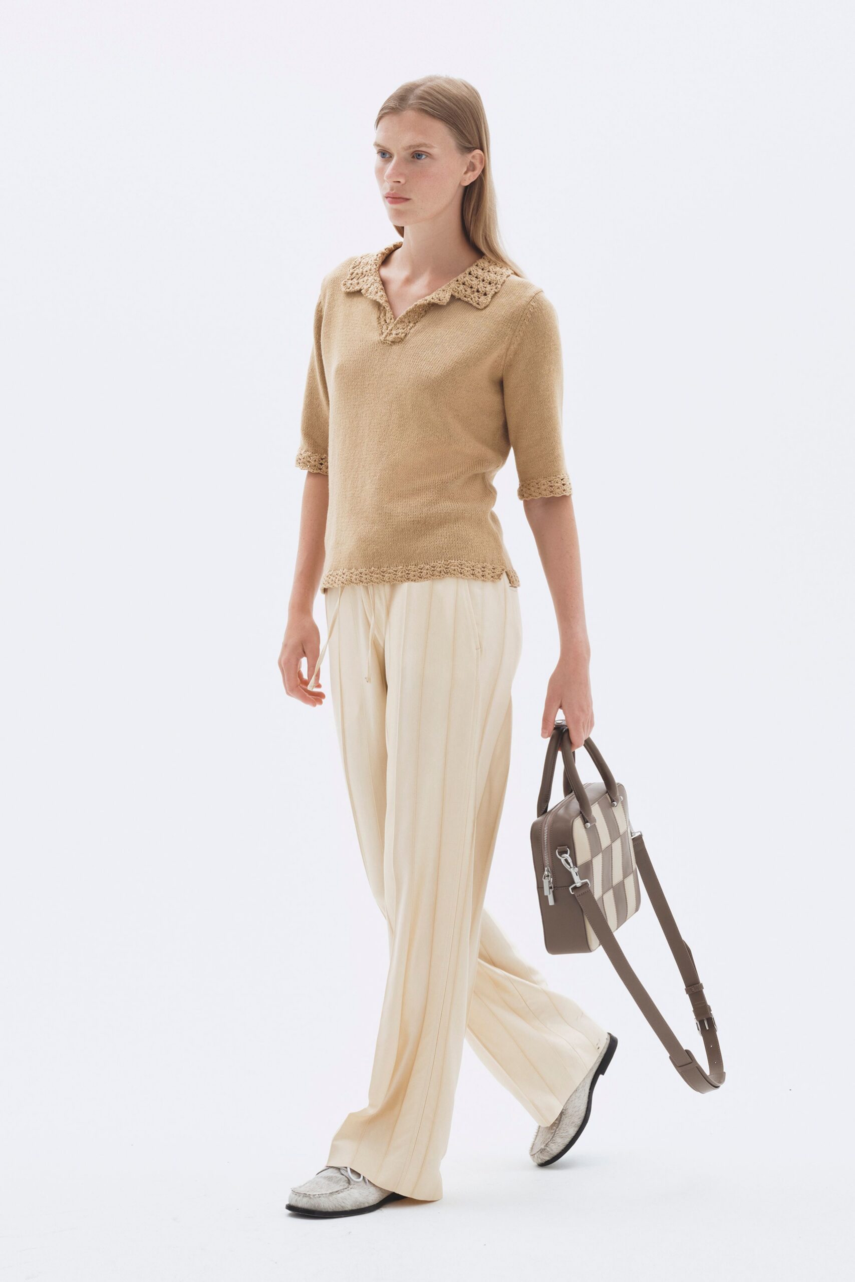 beige top with white pants