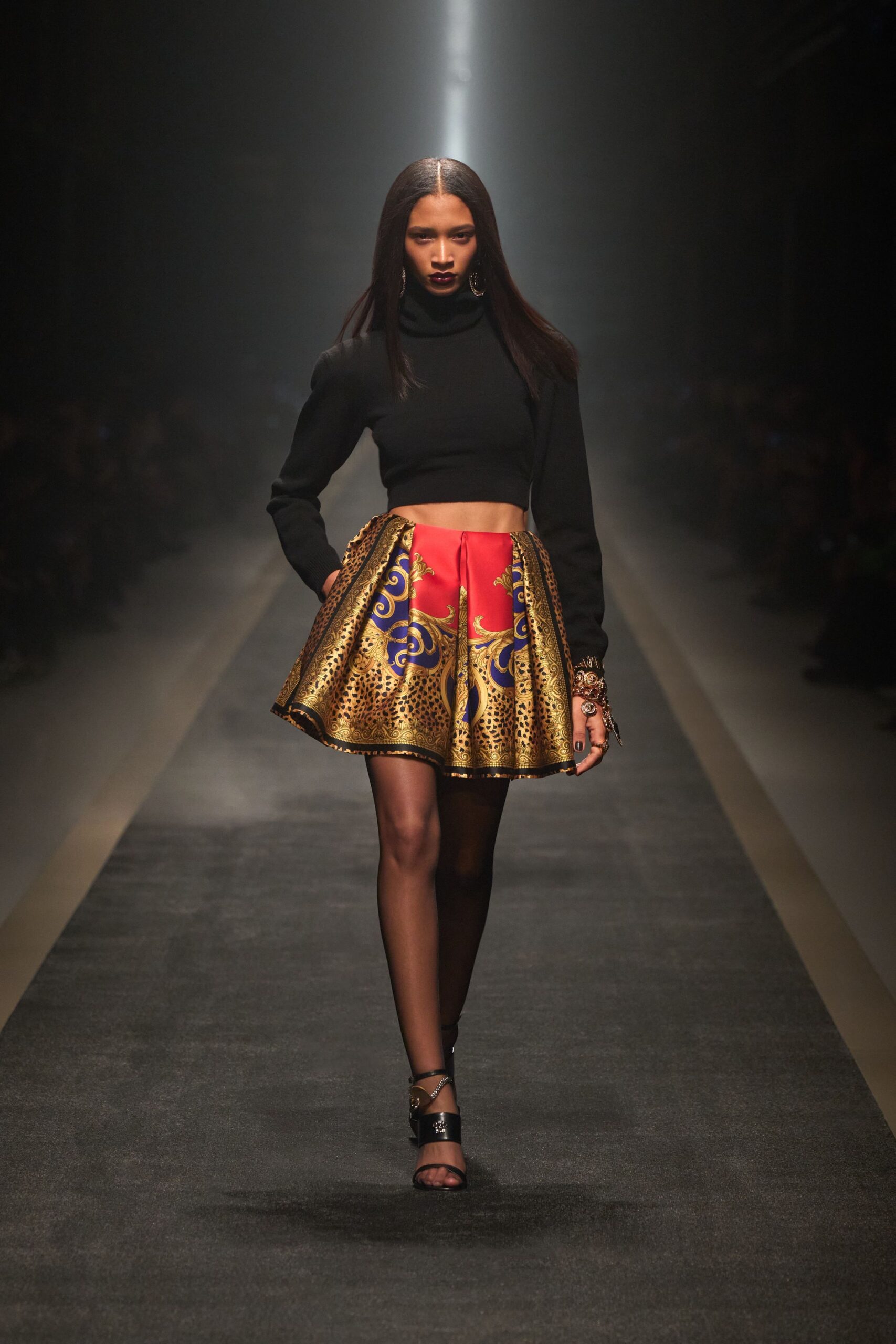 black fitted top with mini skirt