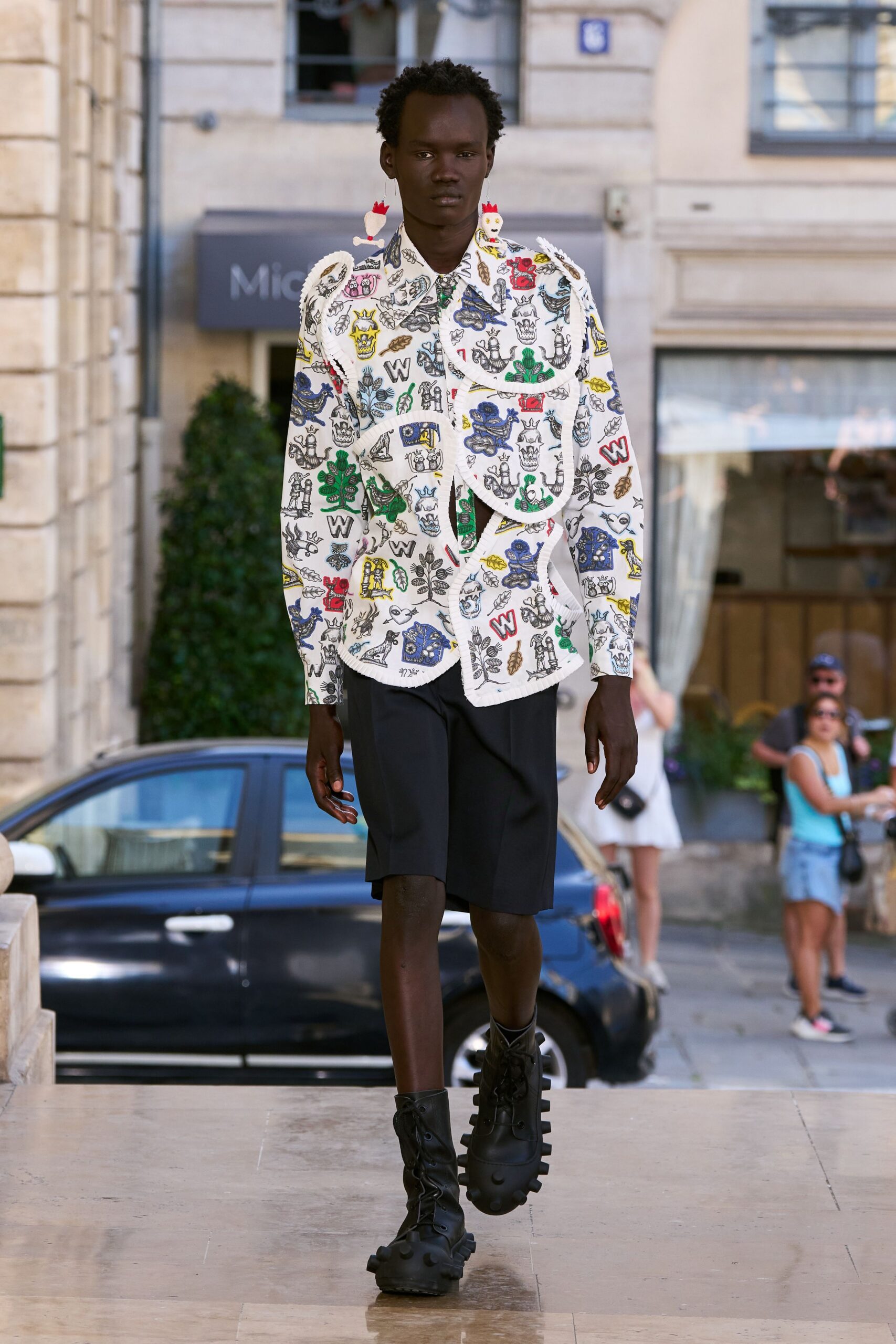 white printed shirt with black shorts