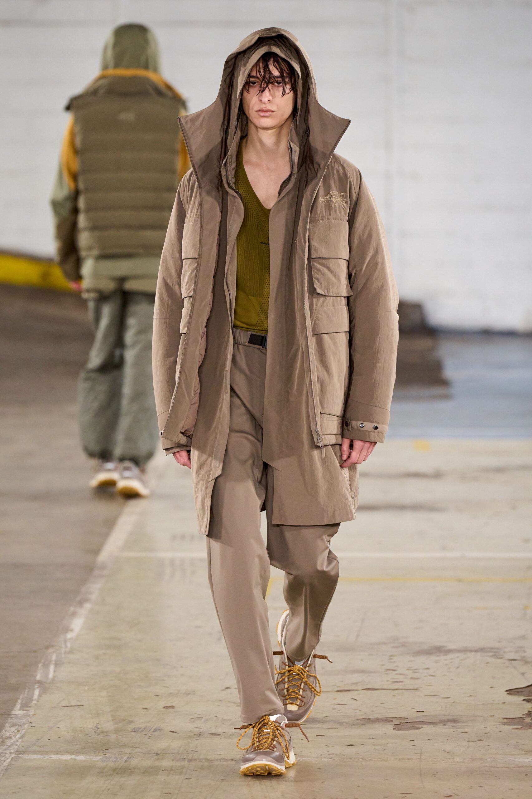 beige parka with green top