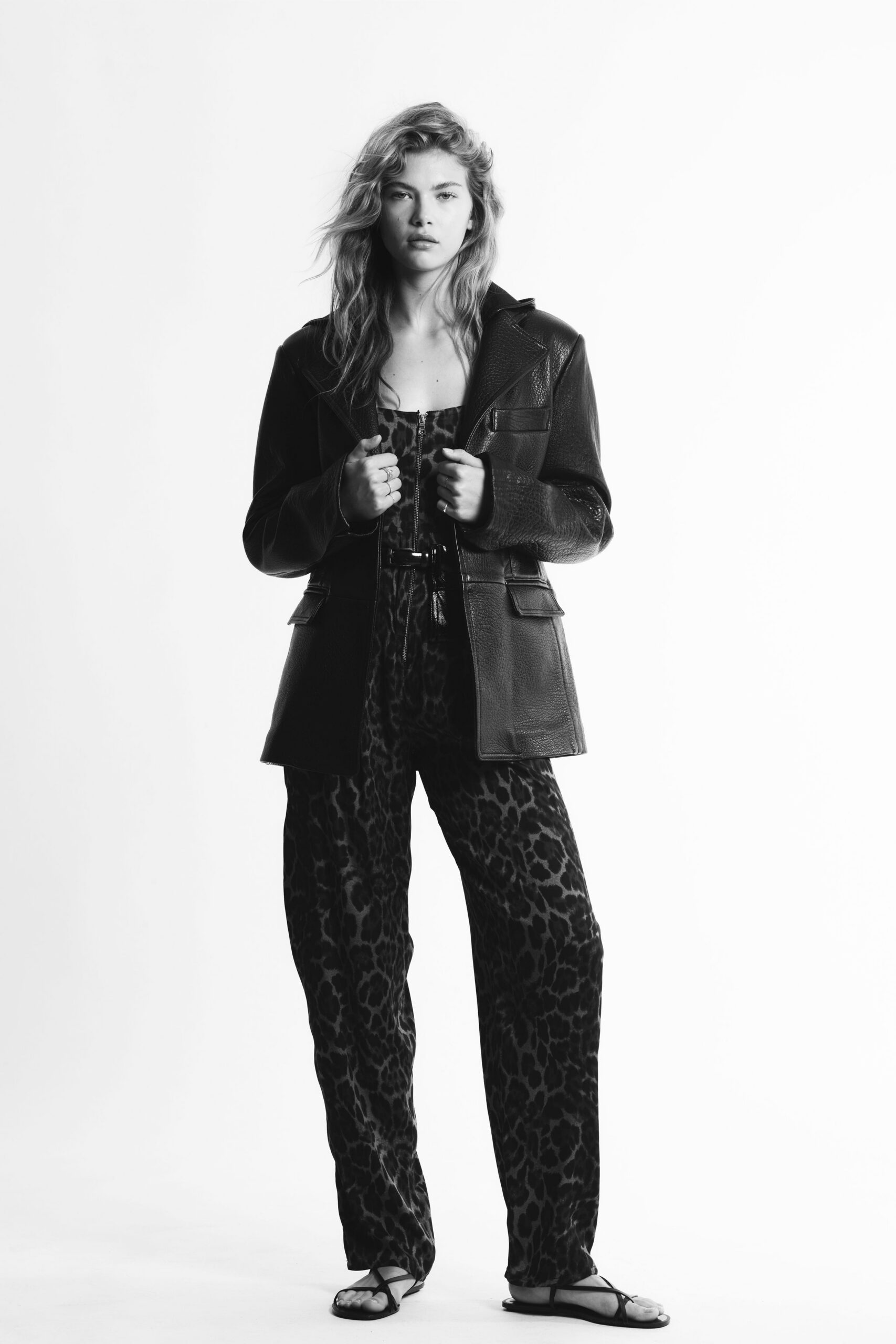 black leather jacket with animal-print pants