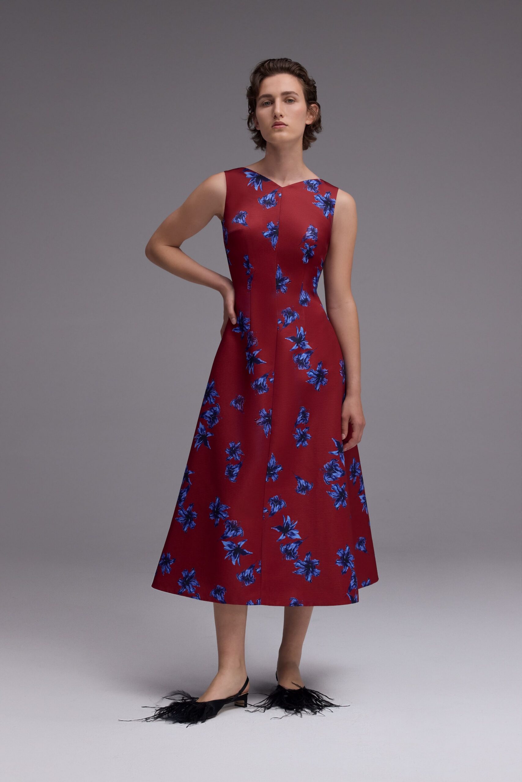red floral midi dress with fringed shoes