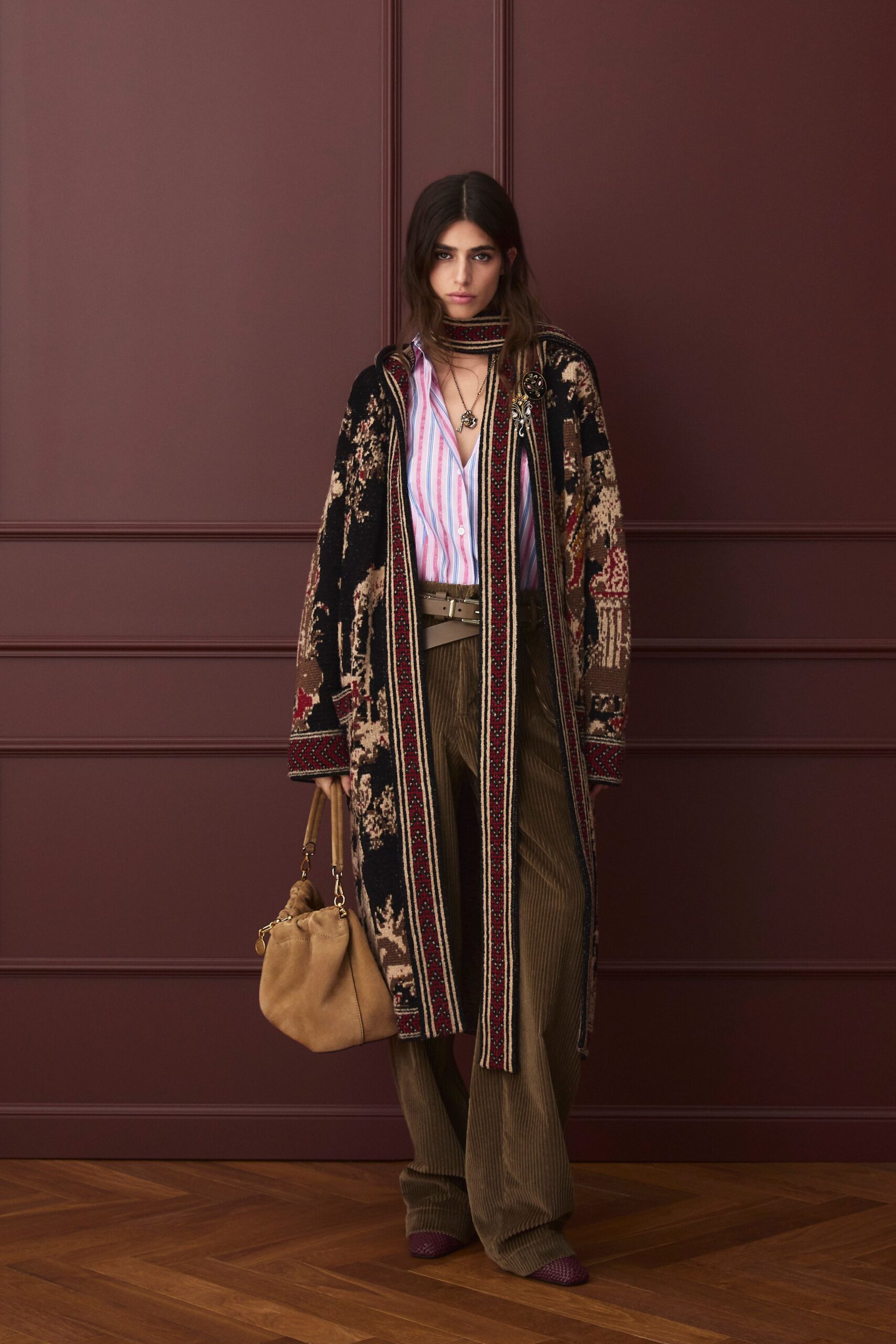 embroidered black coat with striped shirt