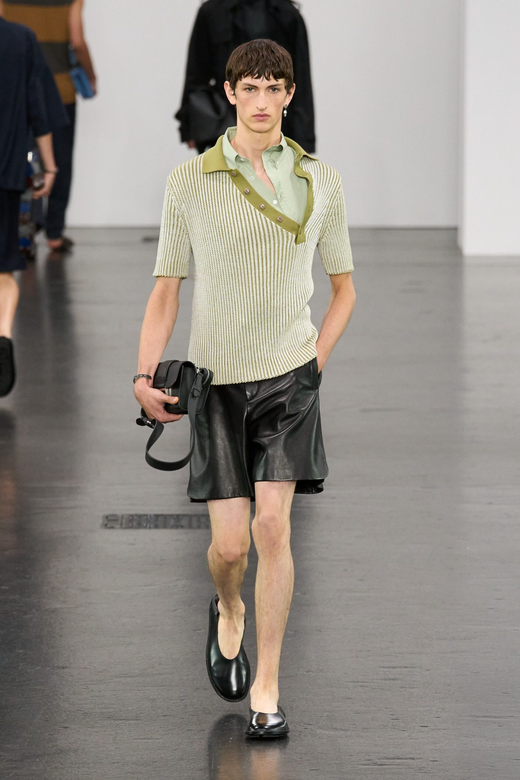 green beige ribbed shirt with black leather shorts