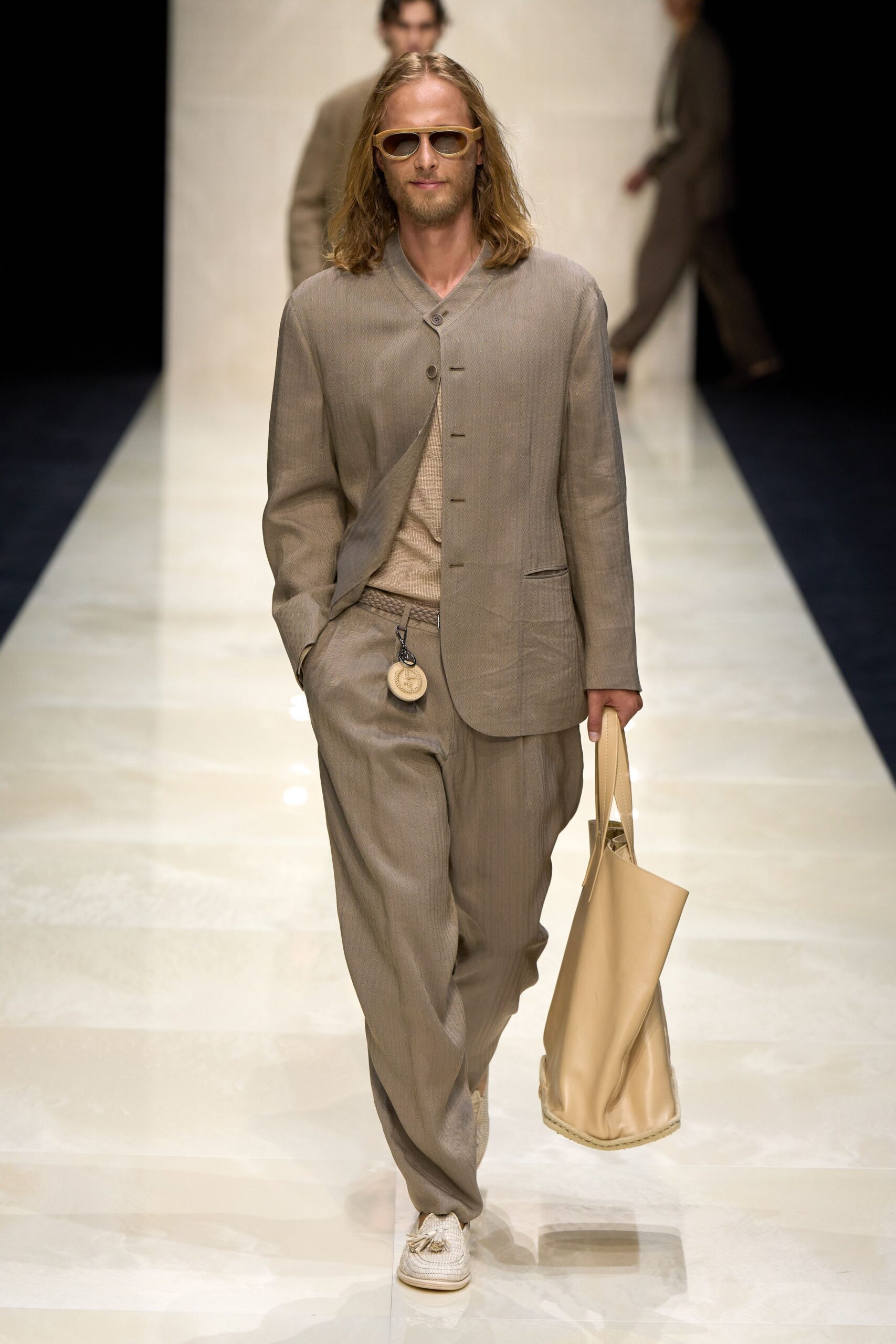 beige tailored suit with sunglasses