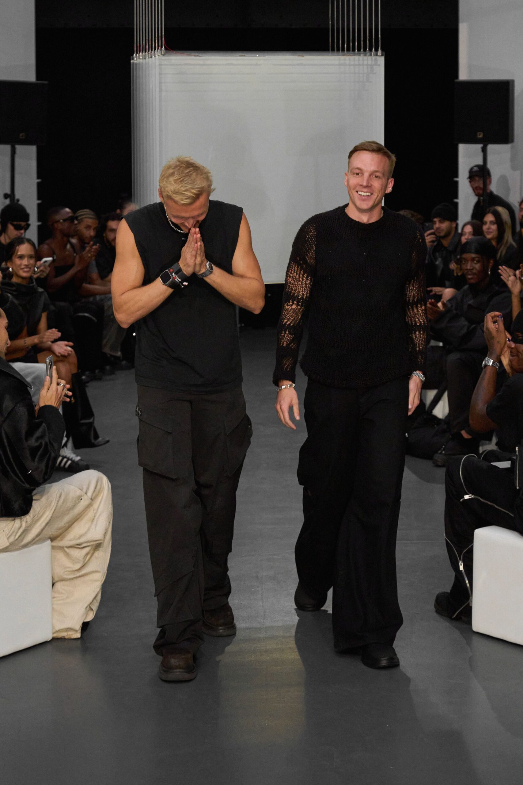black tank-top and beige cargo pants