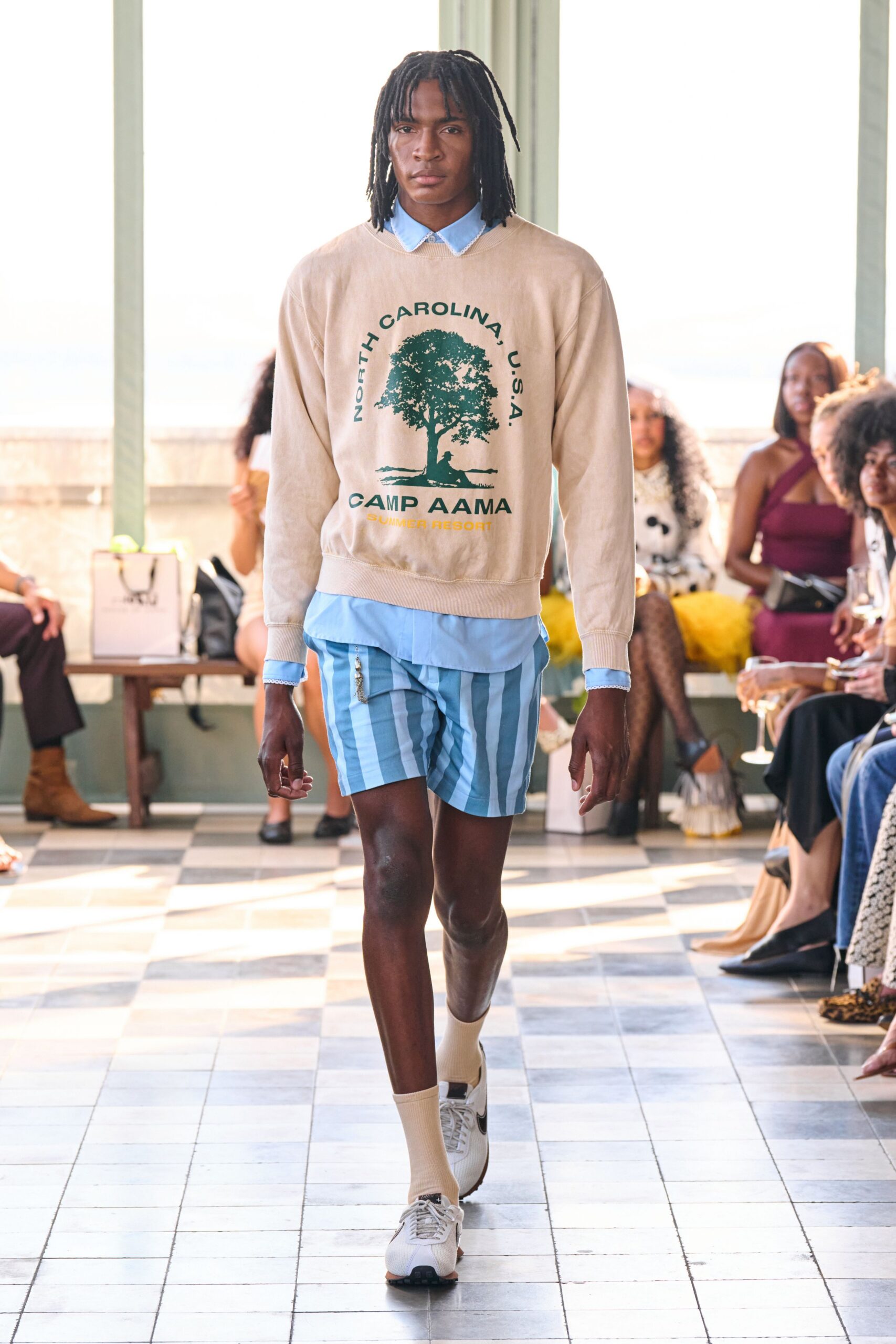 beige relaxed sweater with blue striped shorts