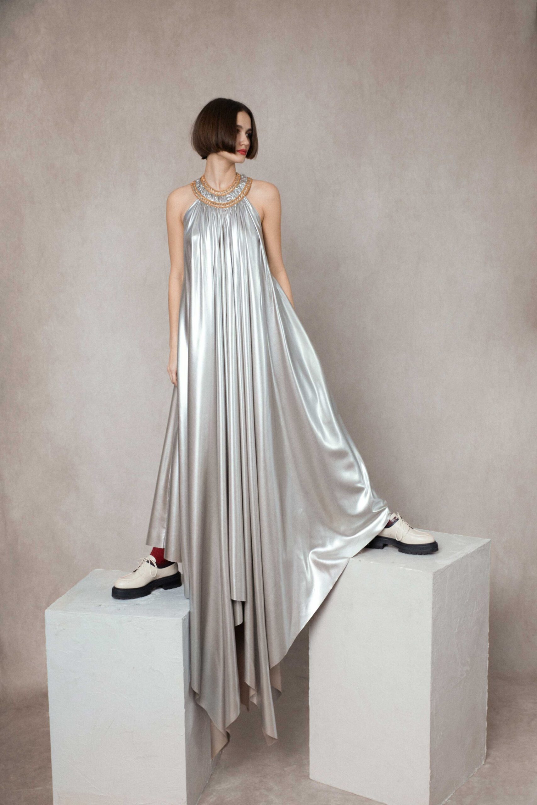 gray satin sleeveless high-neck relaxed draped shiny gown