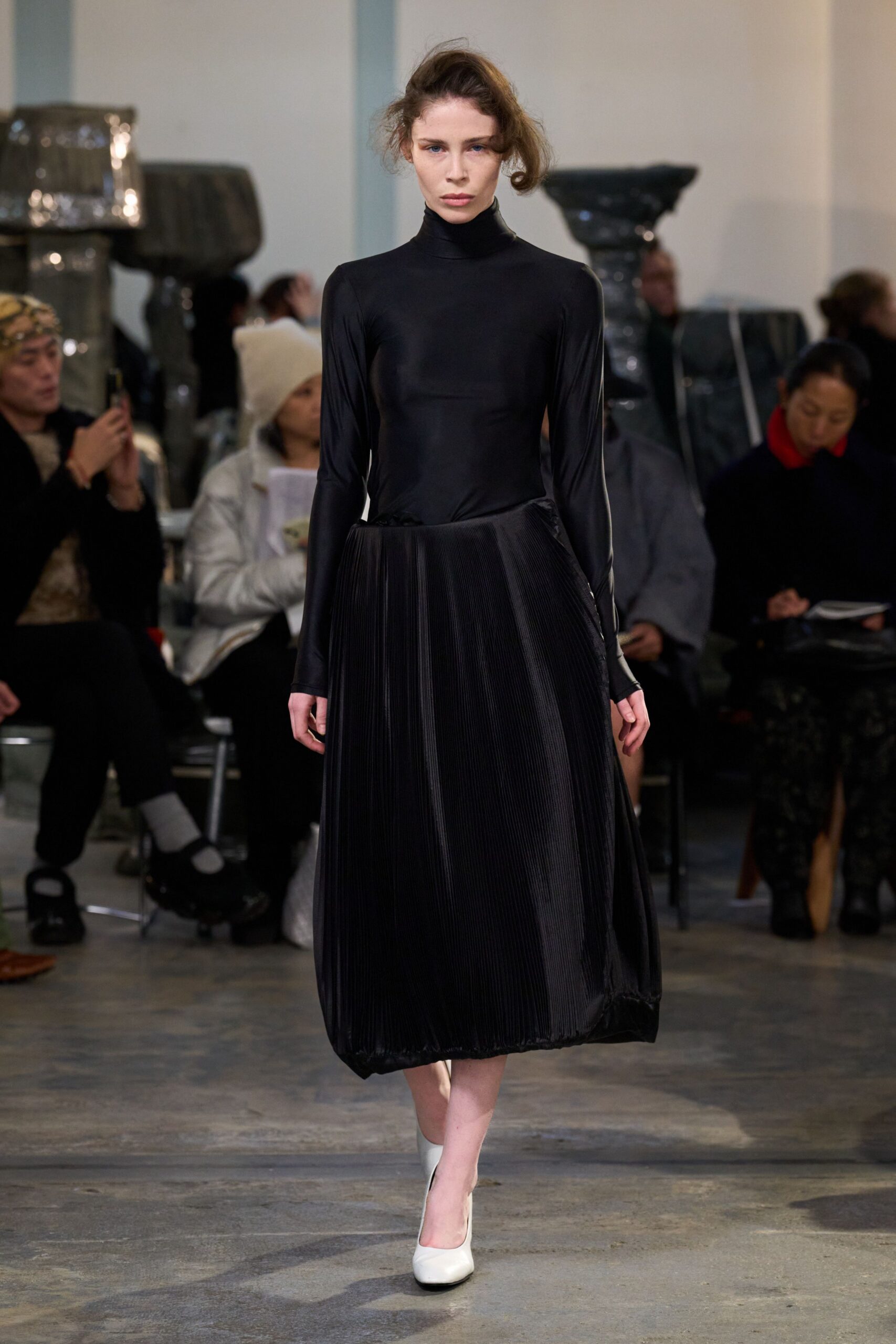 black silk pleated midi dress with white shoes