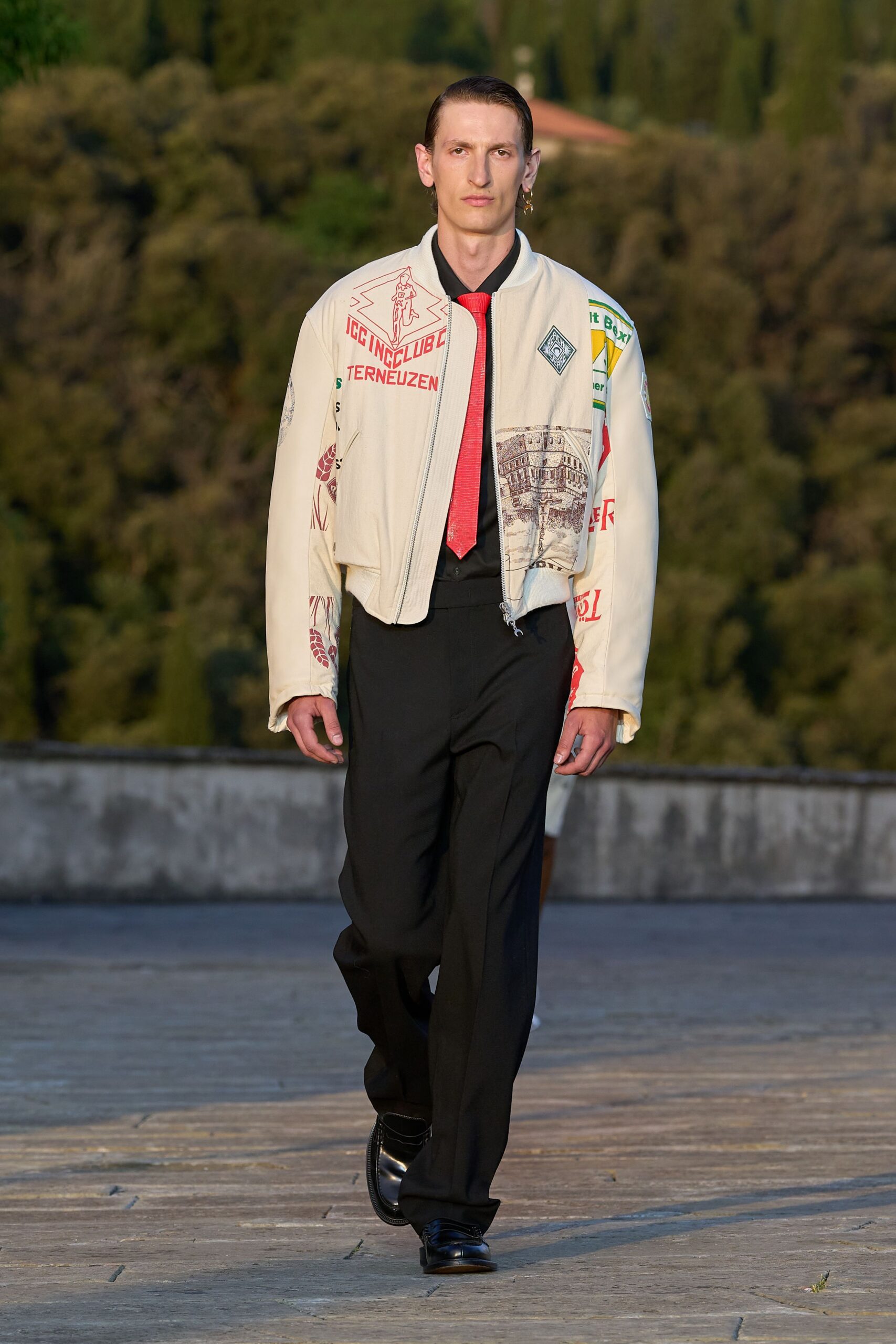 white embroidered jacket with black pants