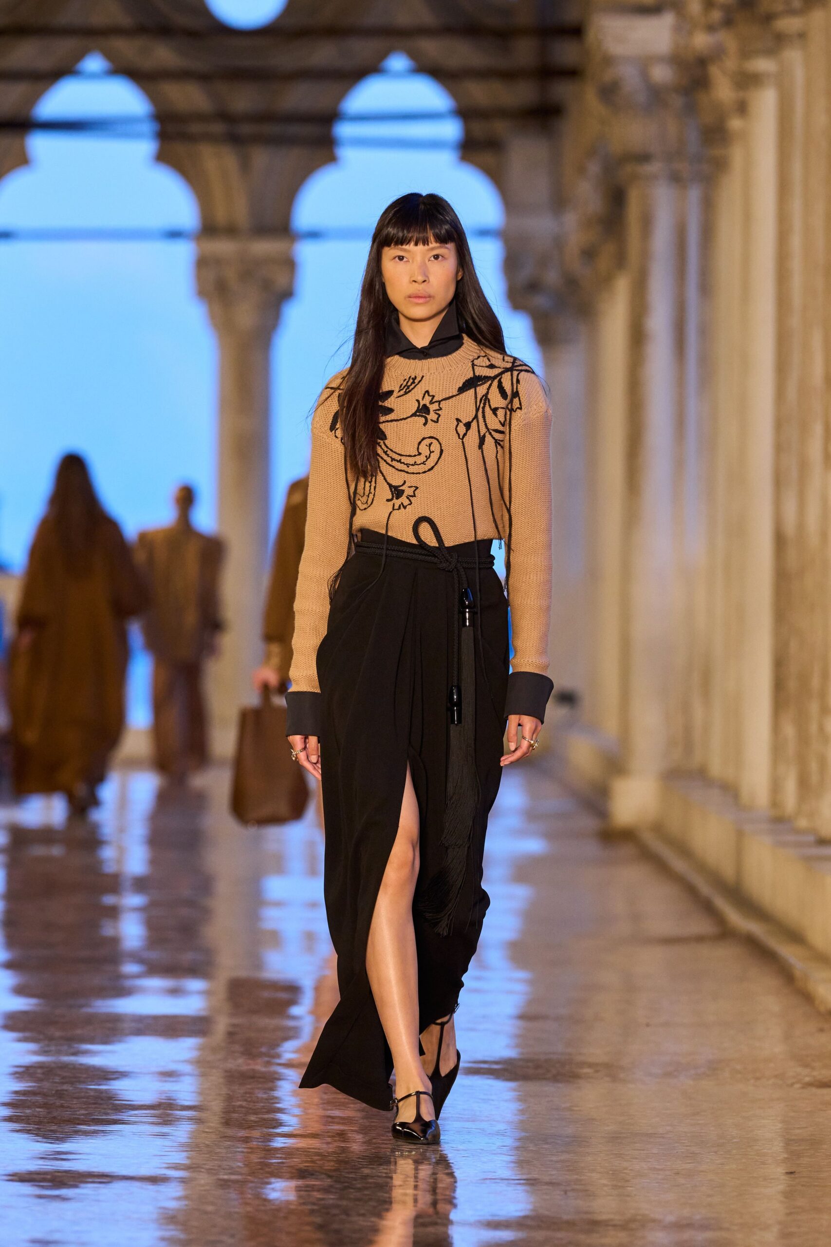 beige embroidered top black skirt