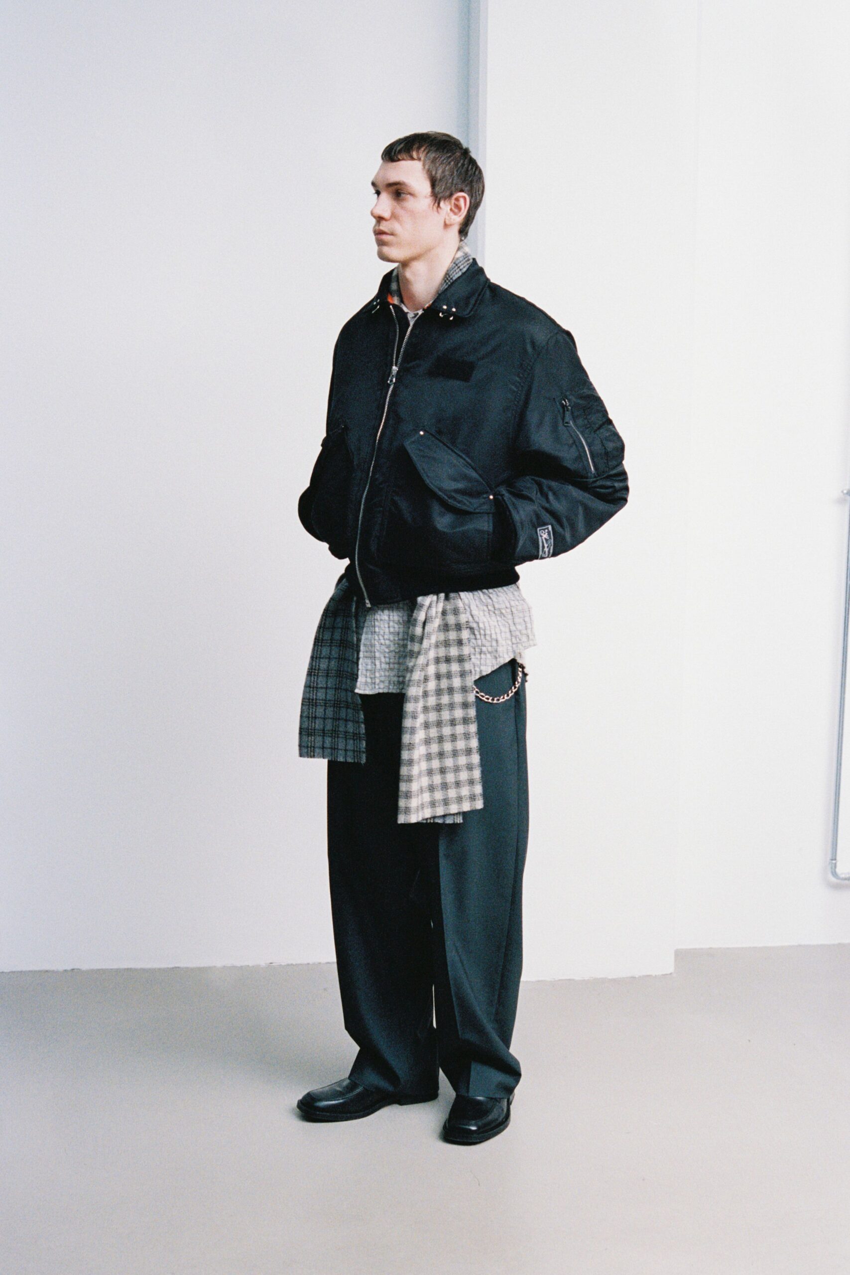 black relaxed jacket with checked shirt