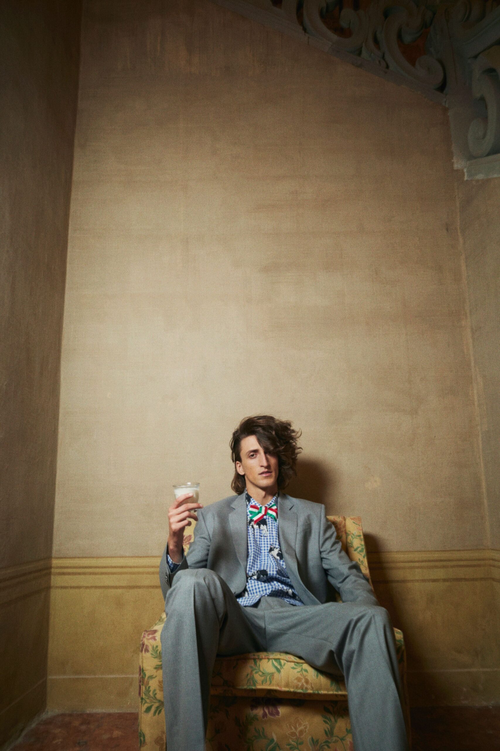 gray tailored suit with blue shirt