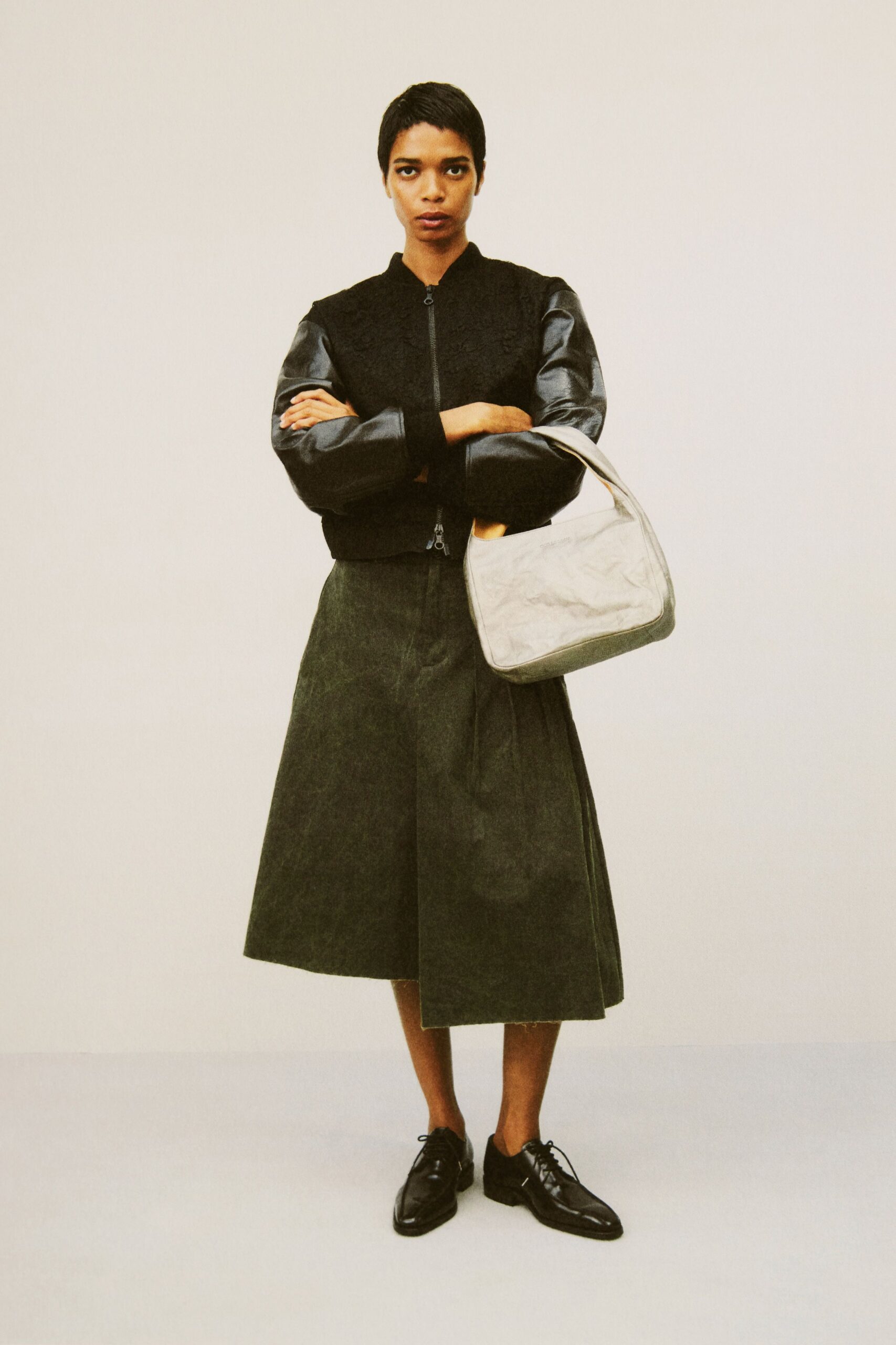 black jacket green midi skirt