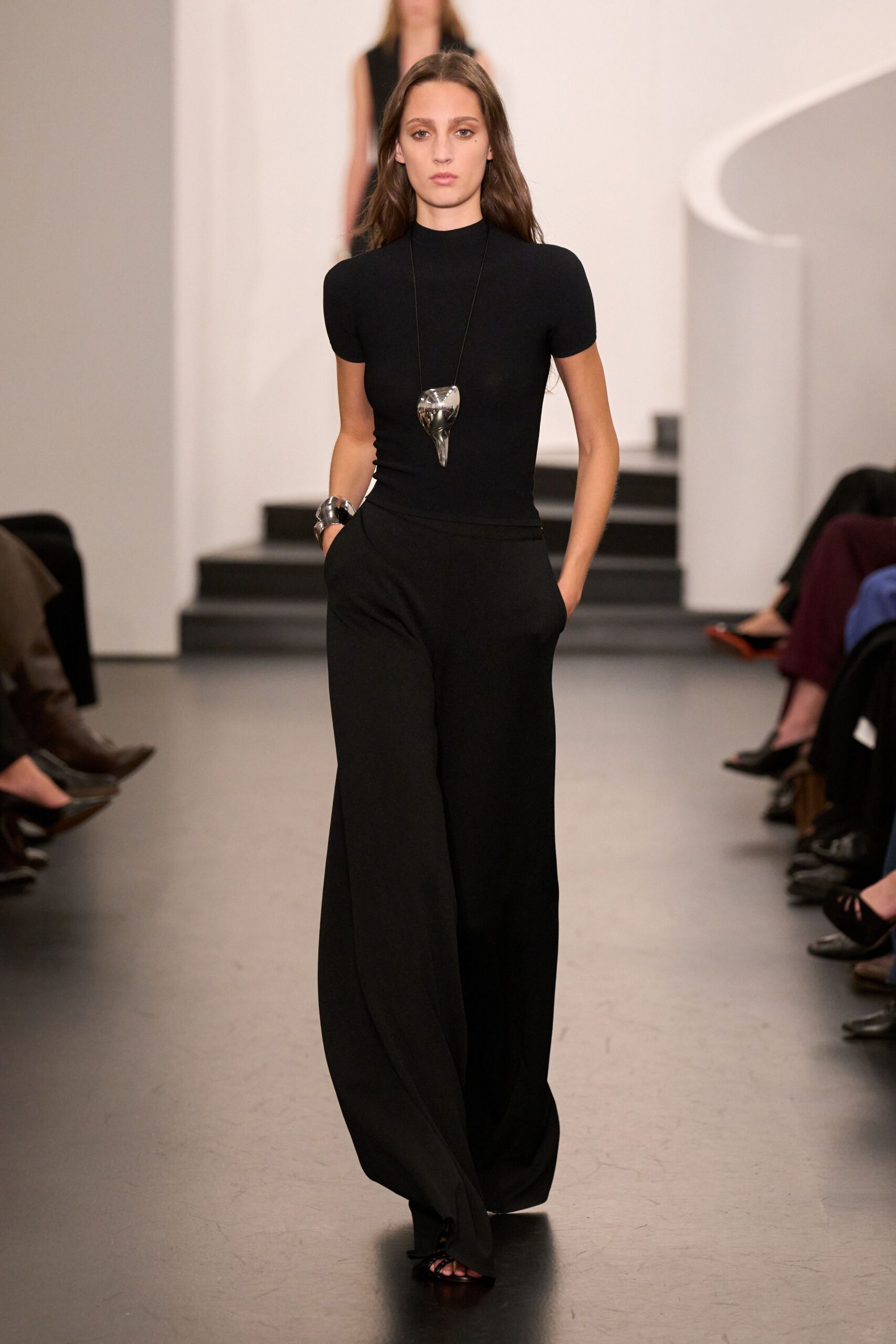 black fitted top and relaxed pants