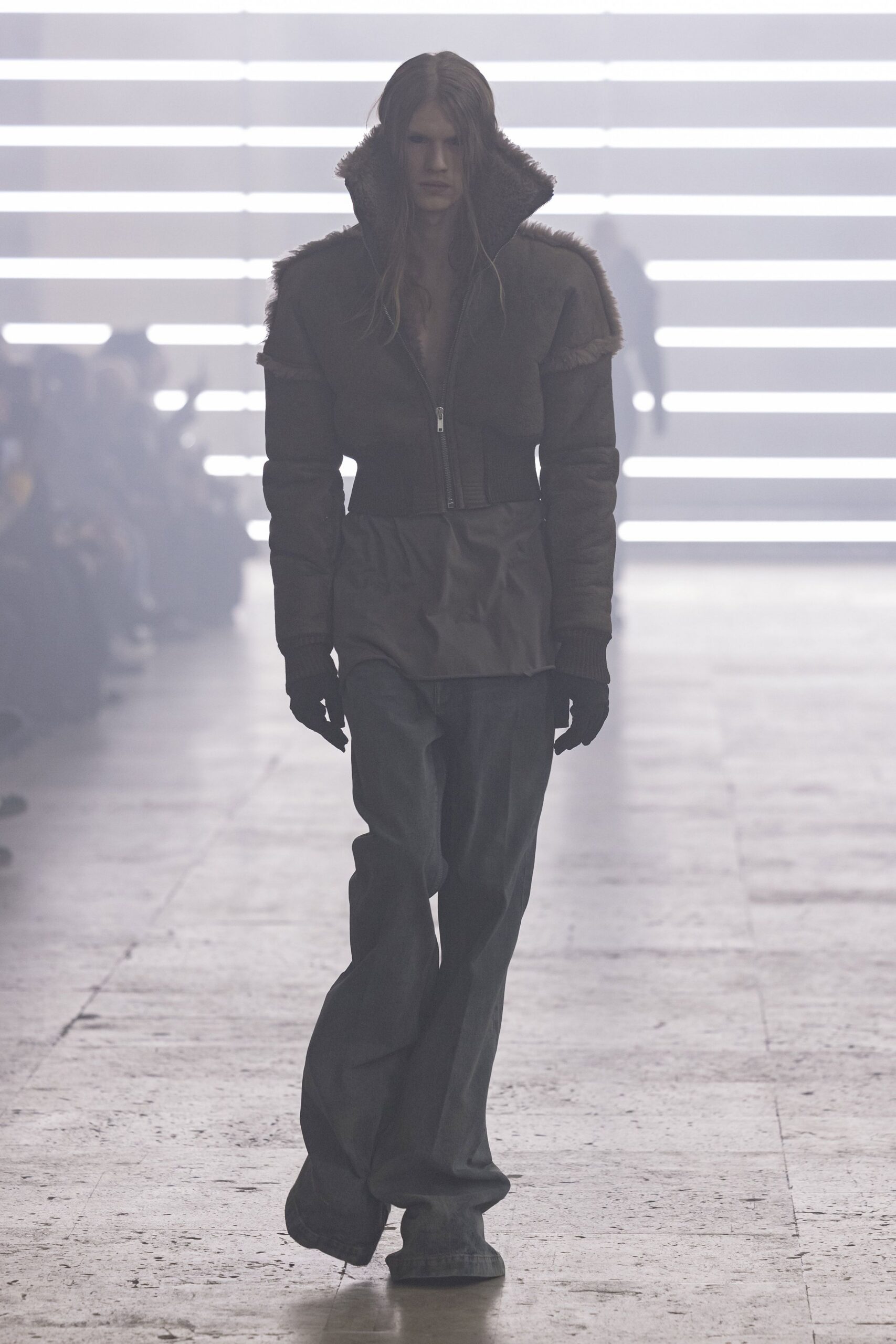 brown leather jacket with gray pants