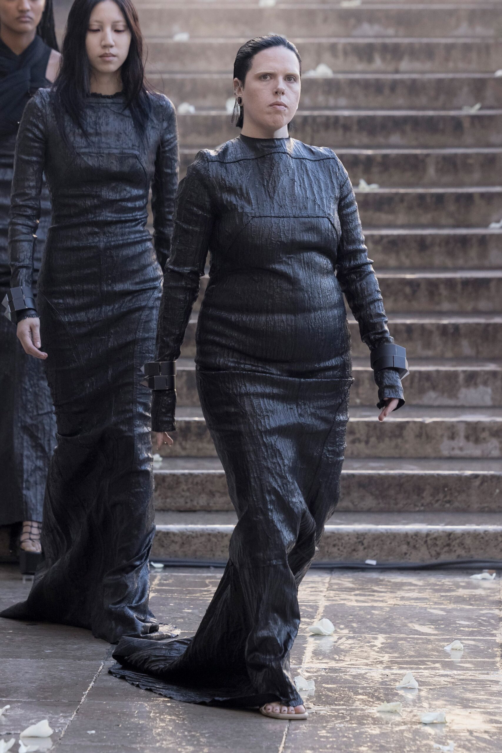 black pleated long-sleeve gown