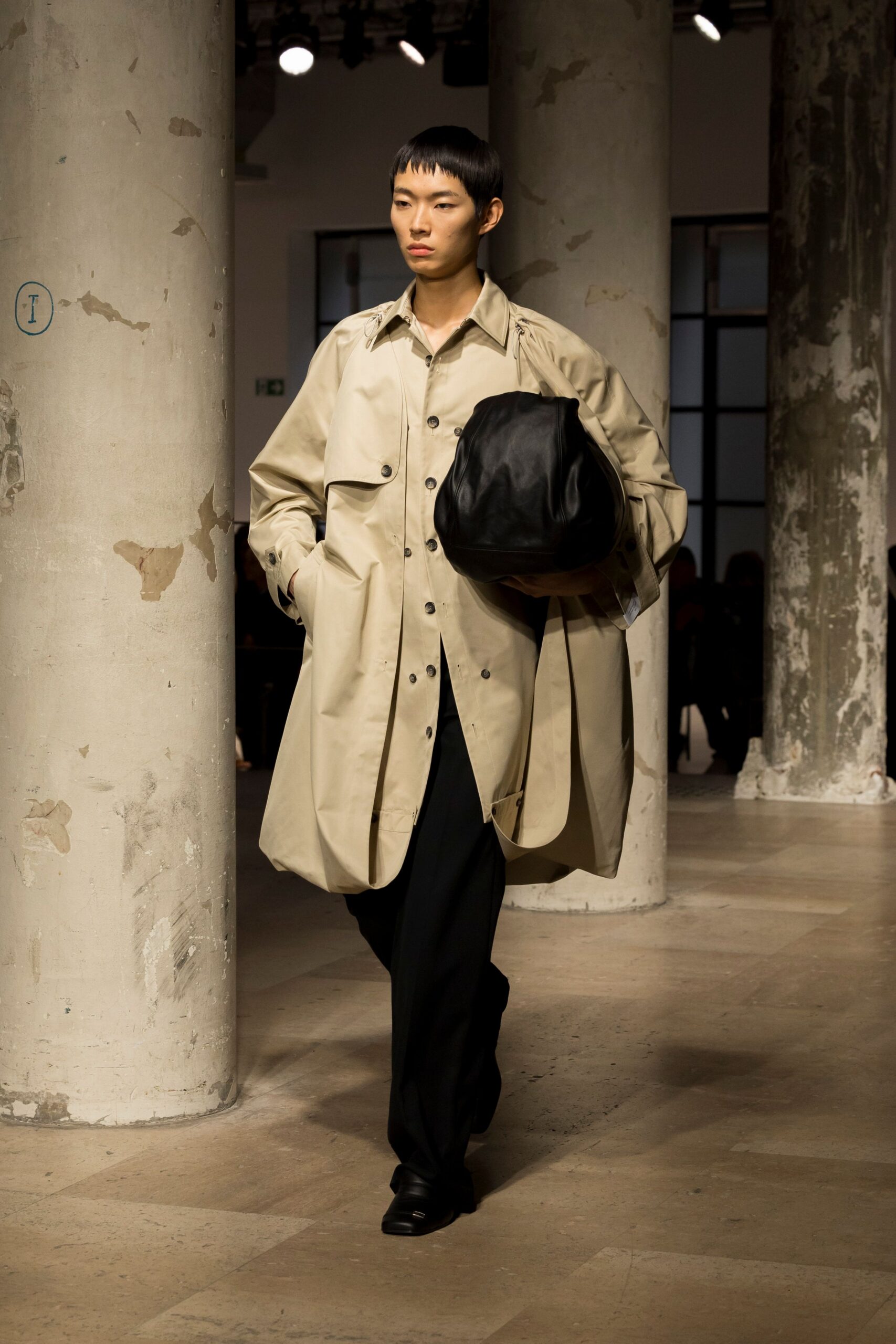 beige trench coat black pants