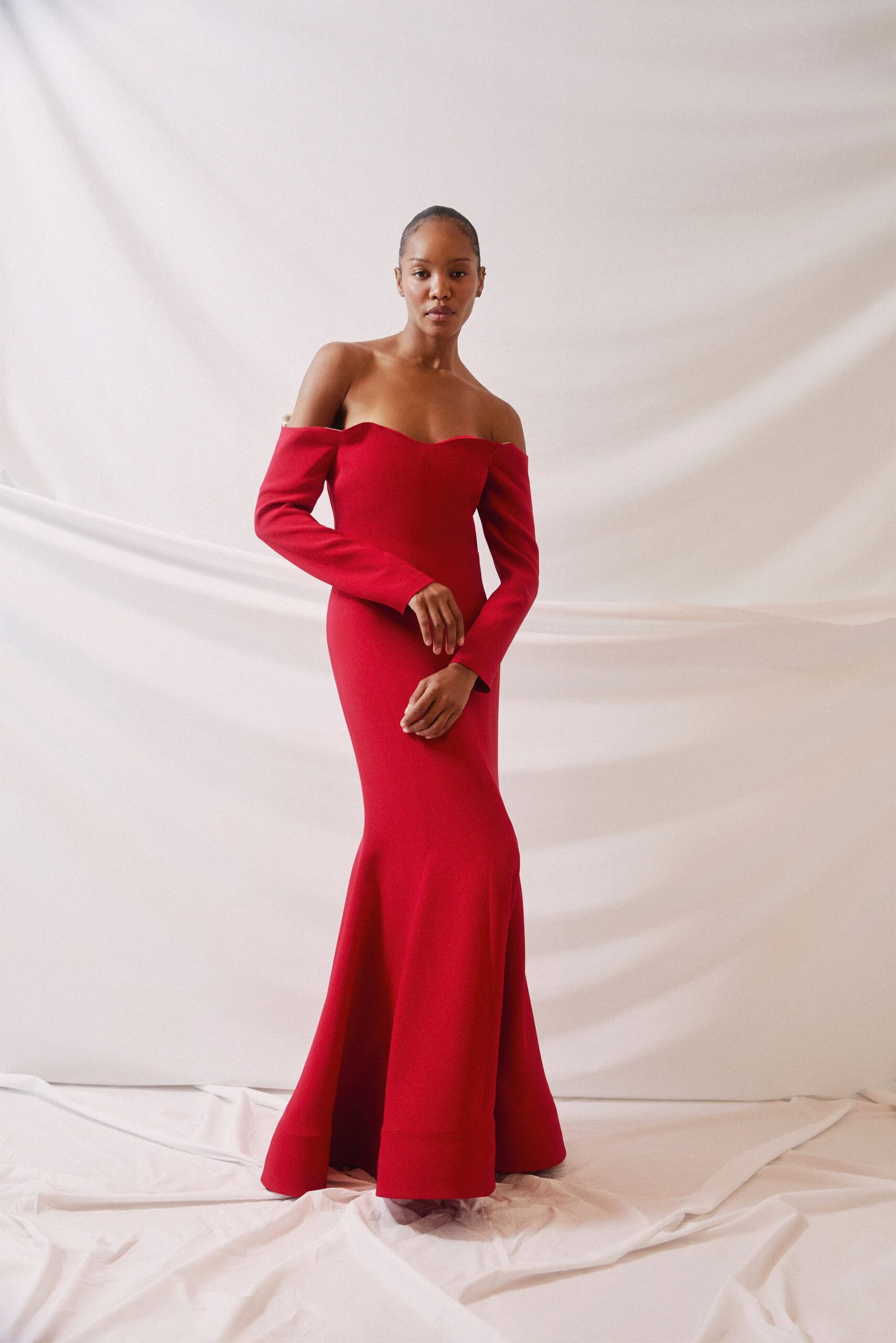 fitted red off-shoulder gown