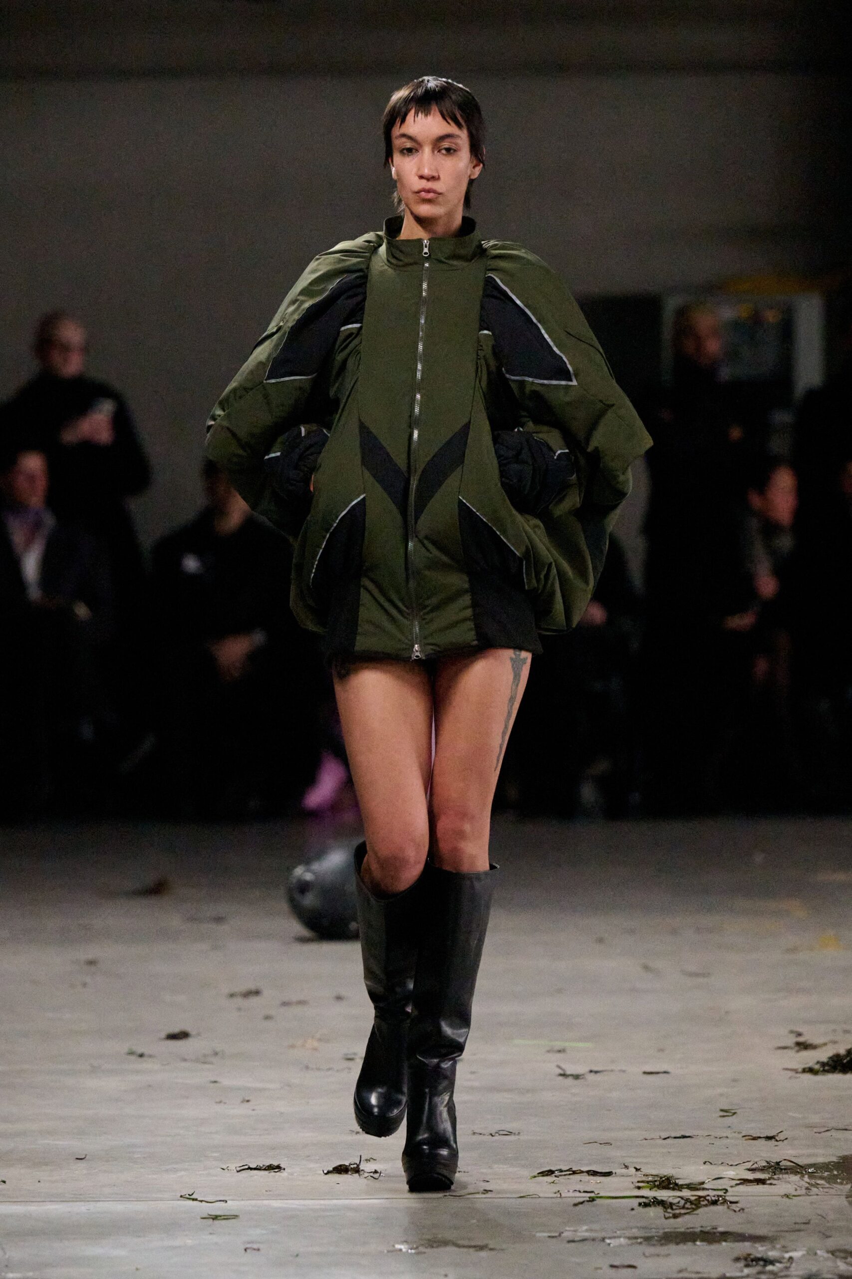 oversized green jacket with black shorts