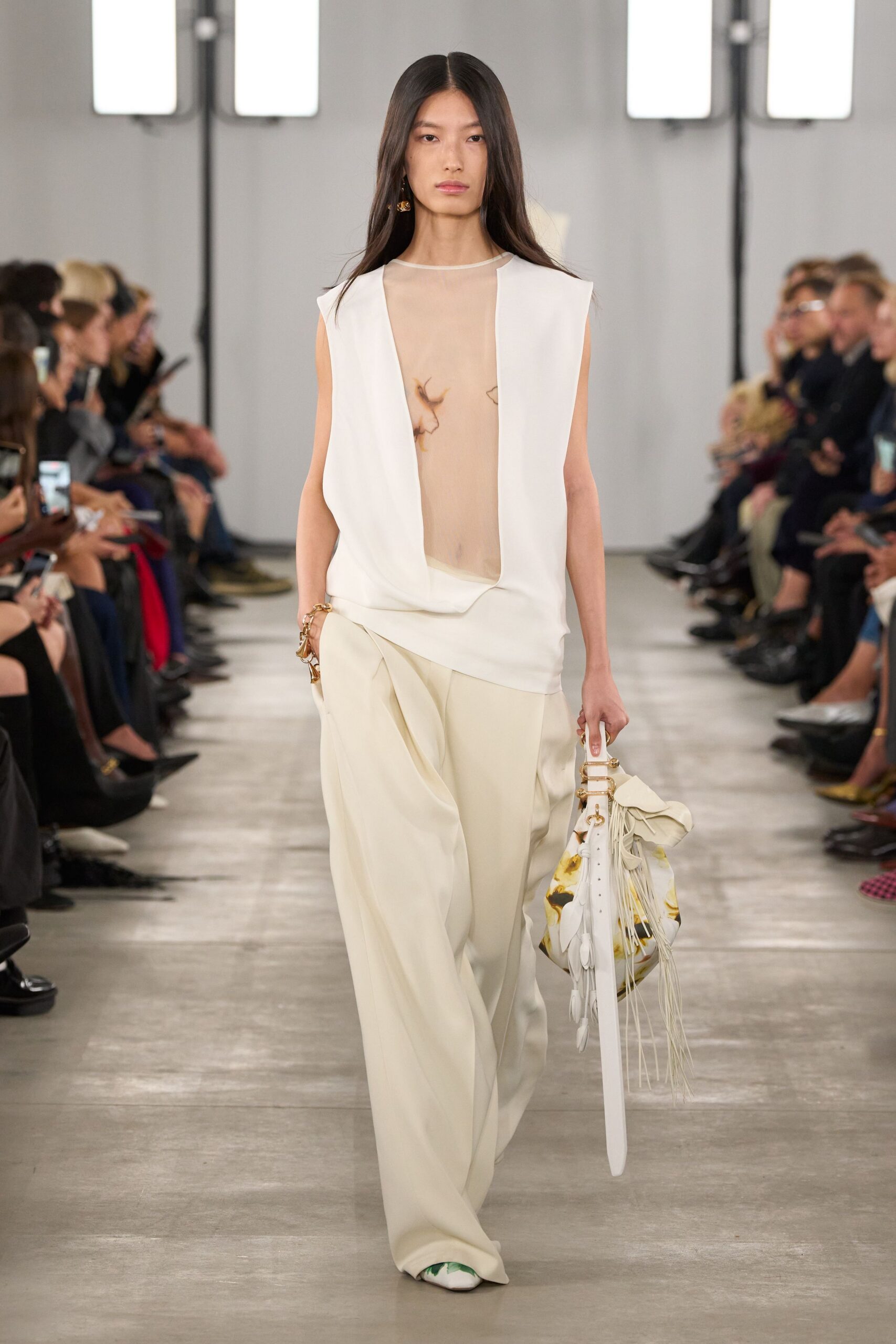 white sheer top beige wide-leg pants