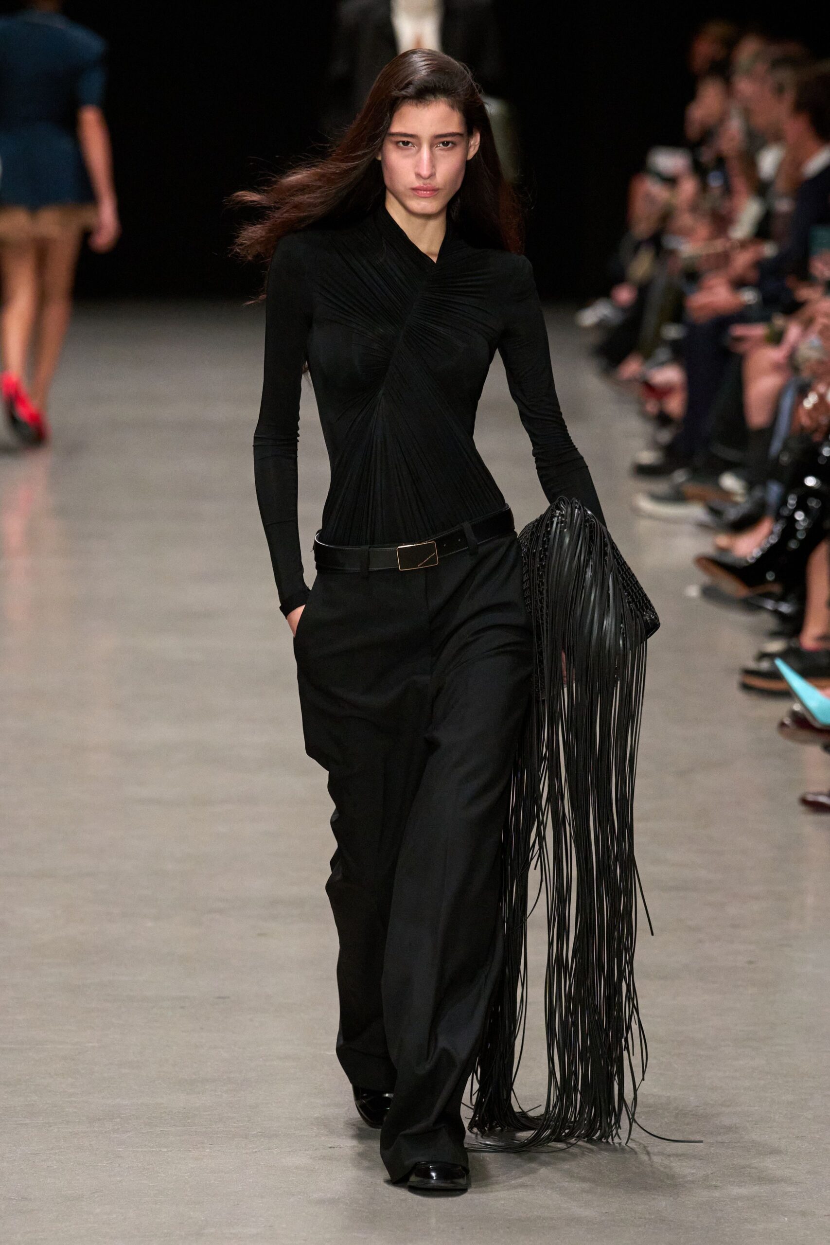 black fitted top and tailored pants