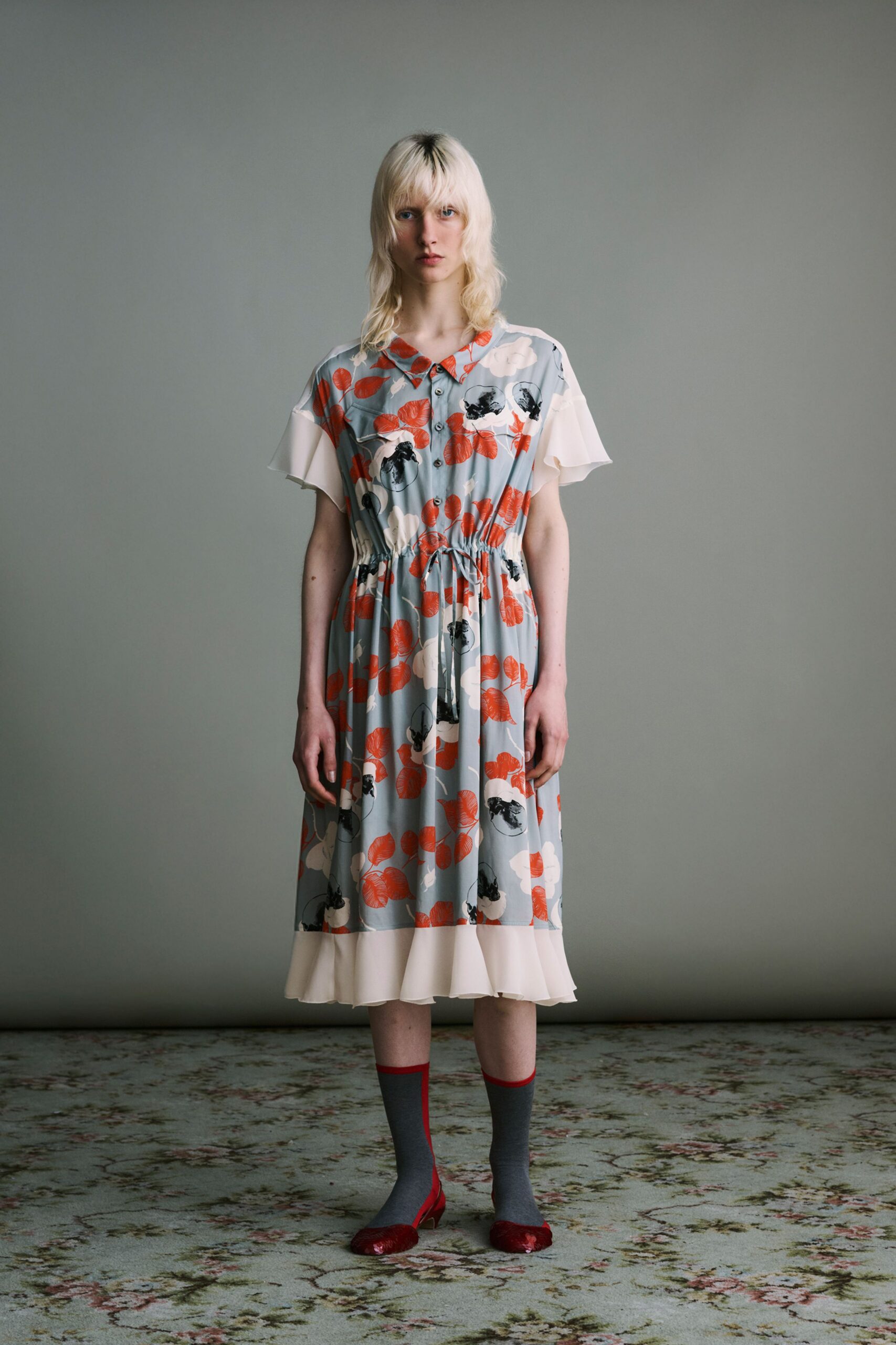 multi-colored midi dress with red shoes
