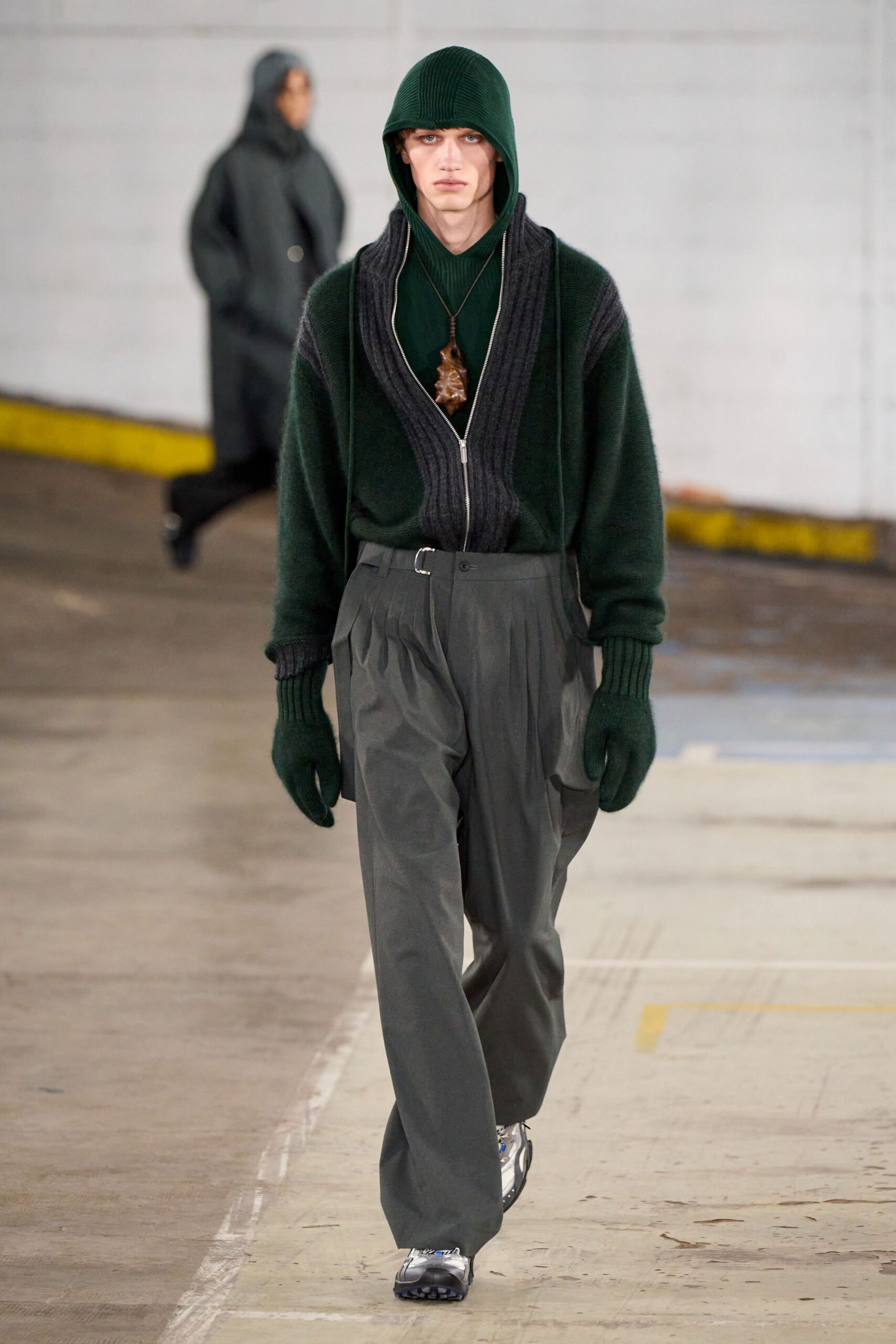 green hoodie and gray pants