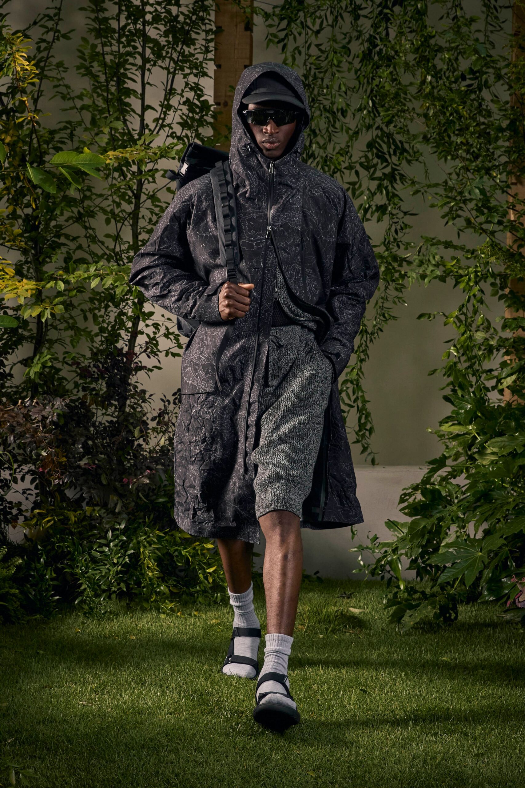 black relaxed coat with gray shorts