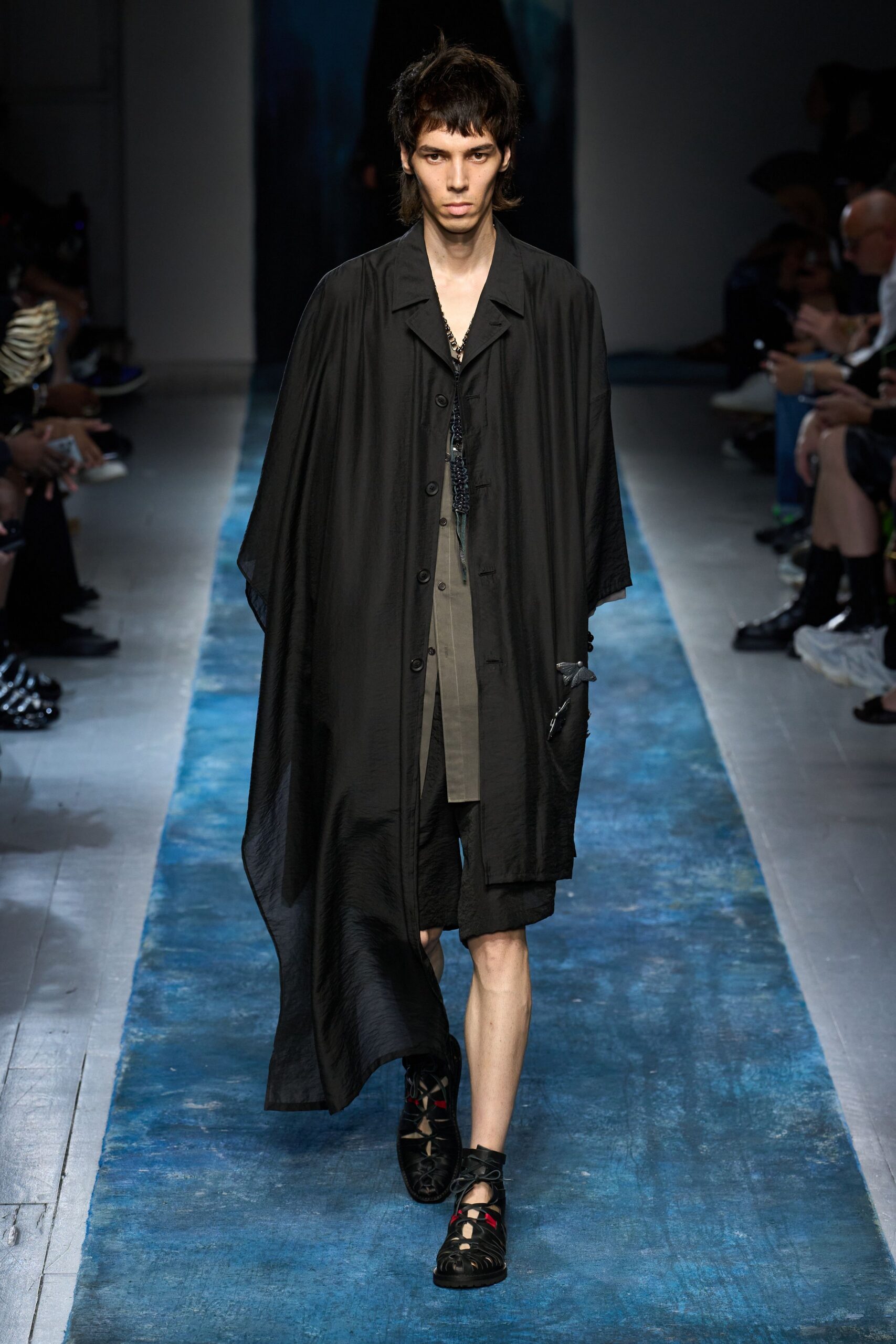 black coat gray shirt black shoes