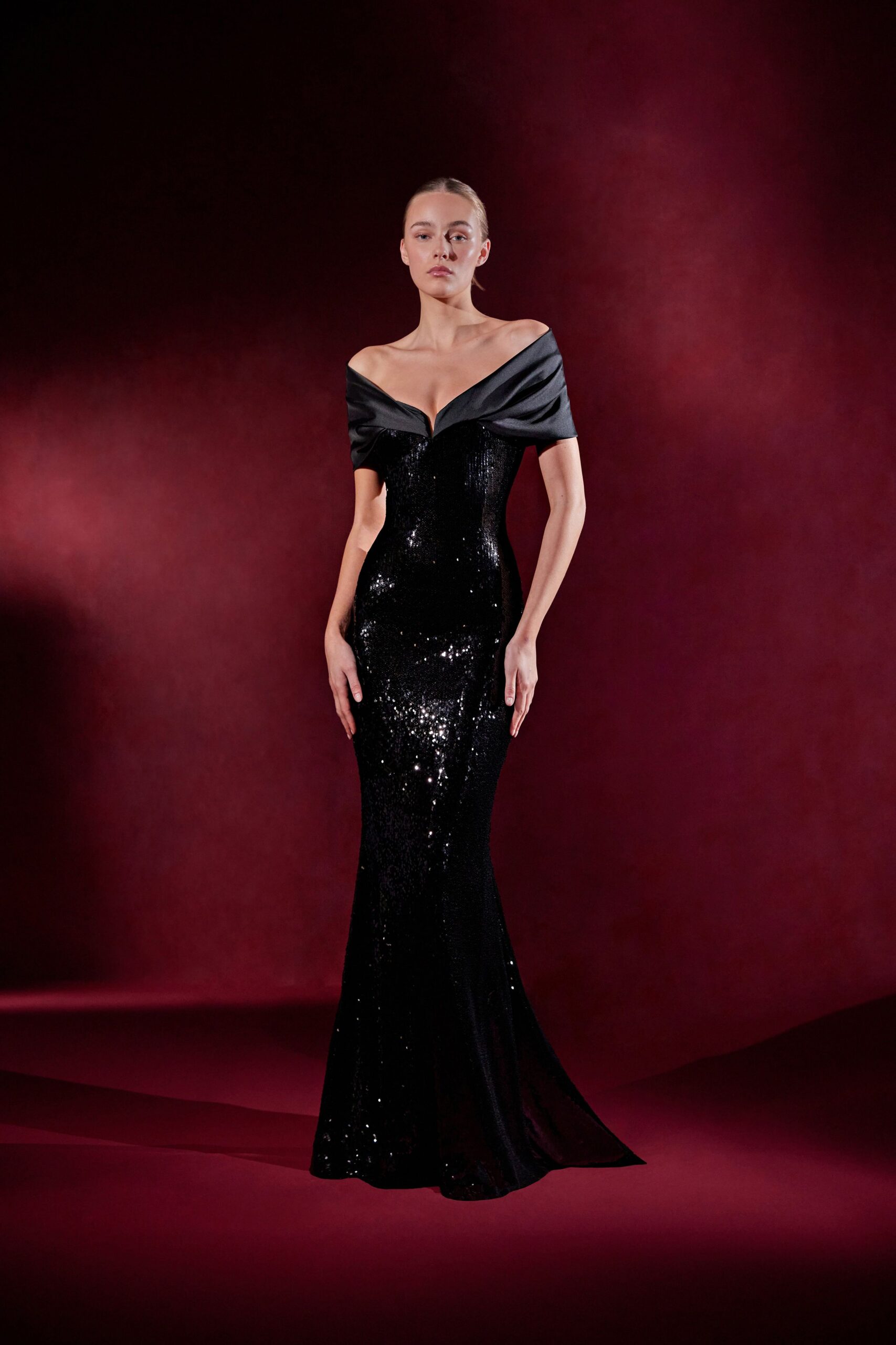 black sequin off-shoulder gown