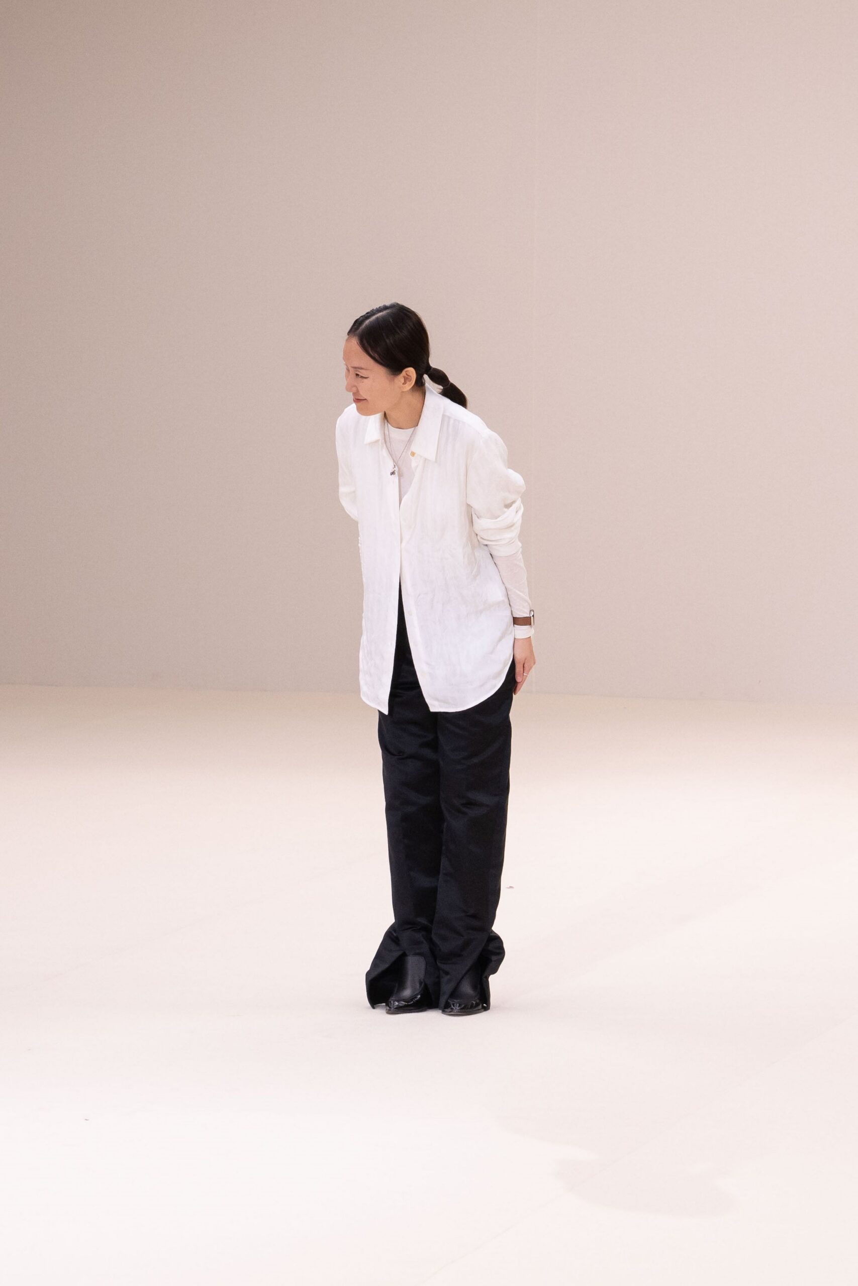 white relaxed shirt black pants