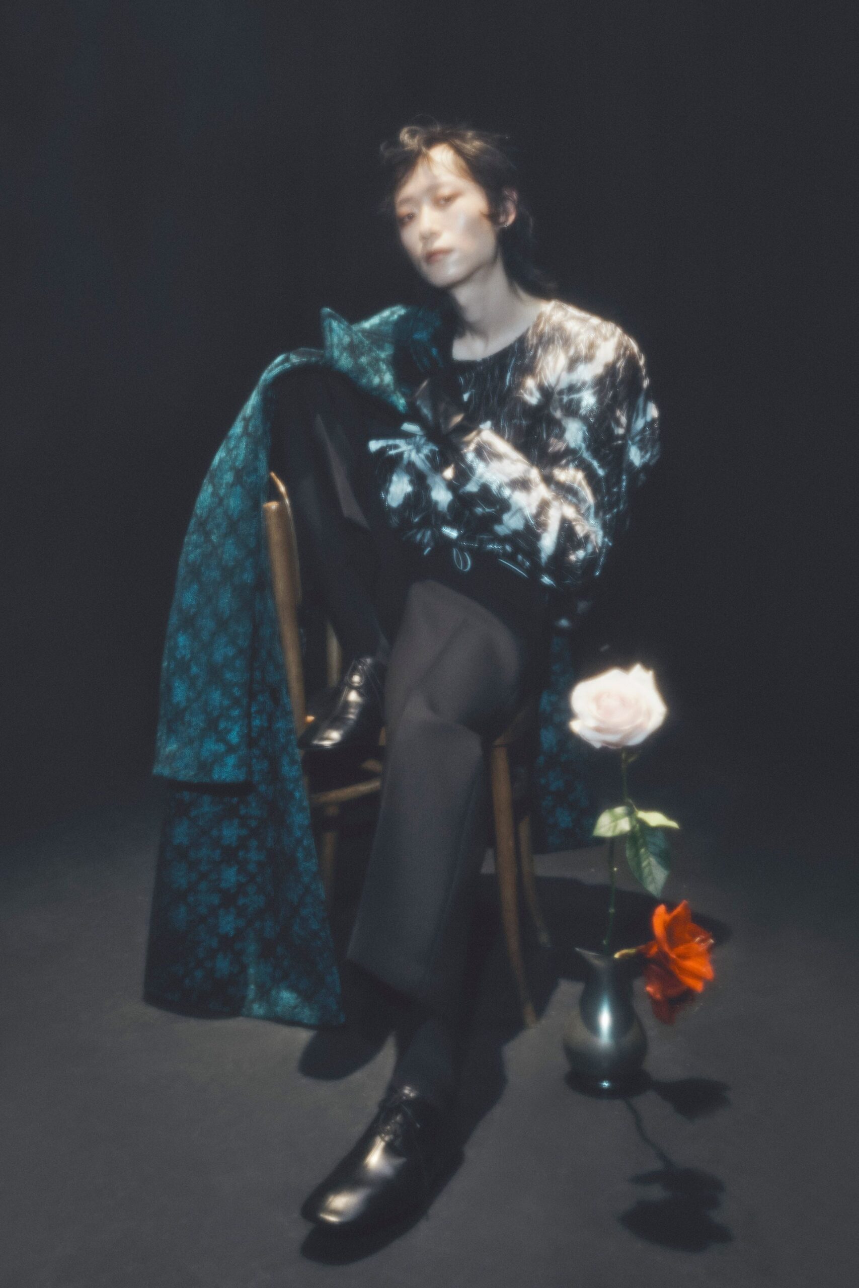 blue floral coat with black shirt