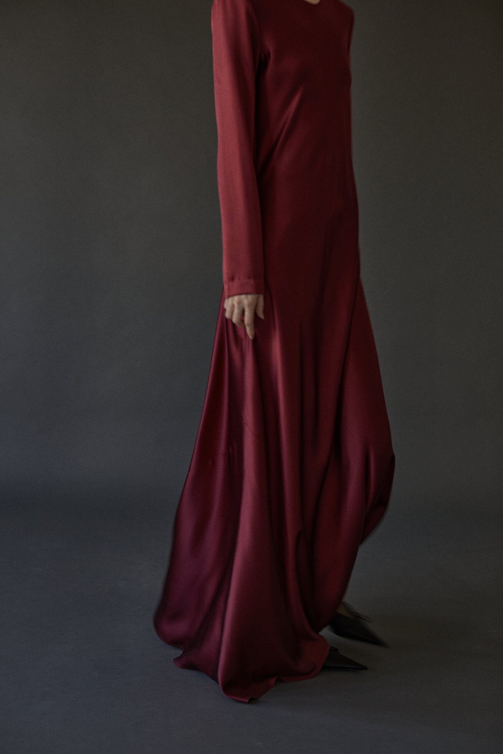 red silk long-sleeve gown
