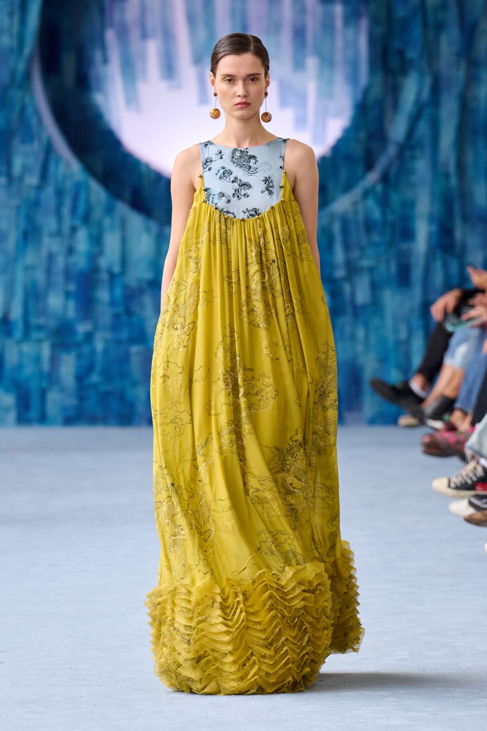 yellow flowing sleeveless gown