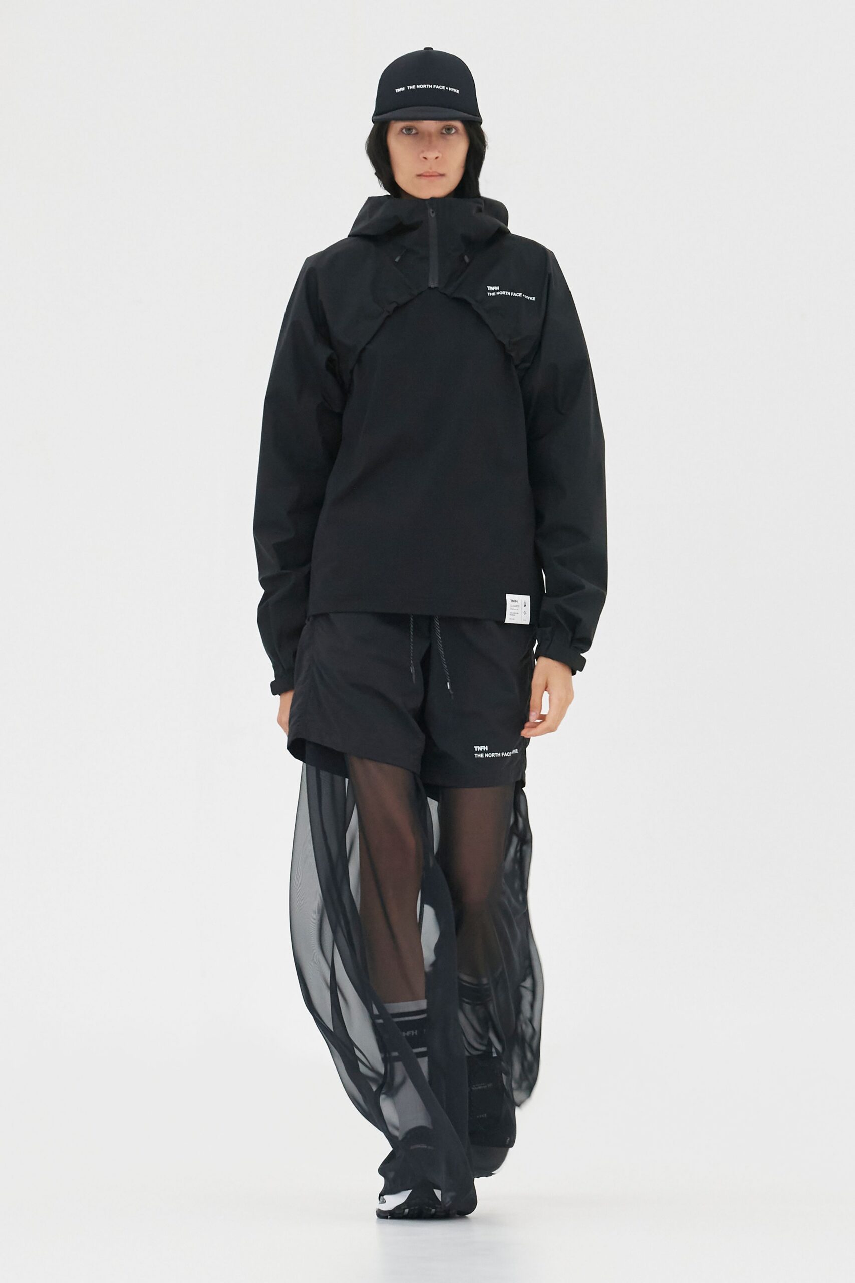 black jacket and shorts with sheer skirt
