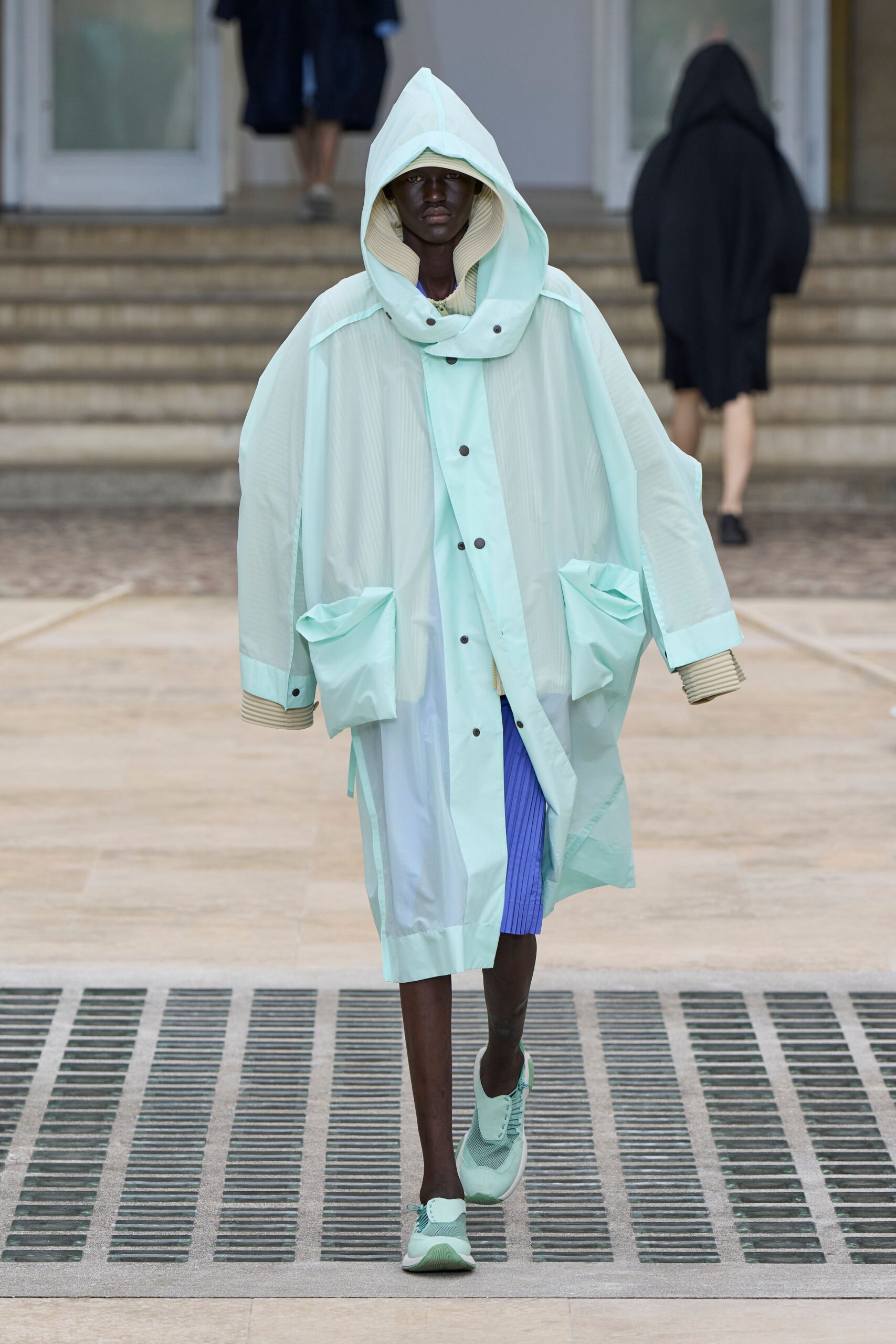 mint oversized coat with blue shorts