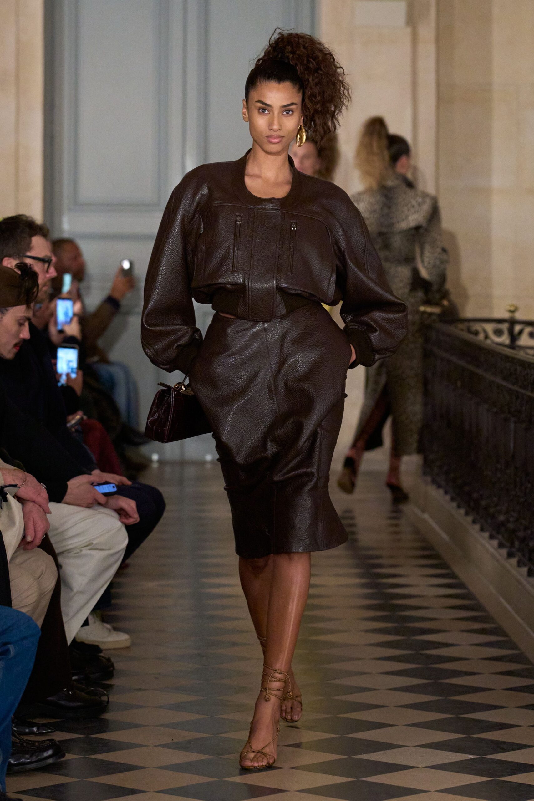 brown leather oversized jacket and fitted skirt