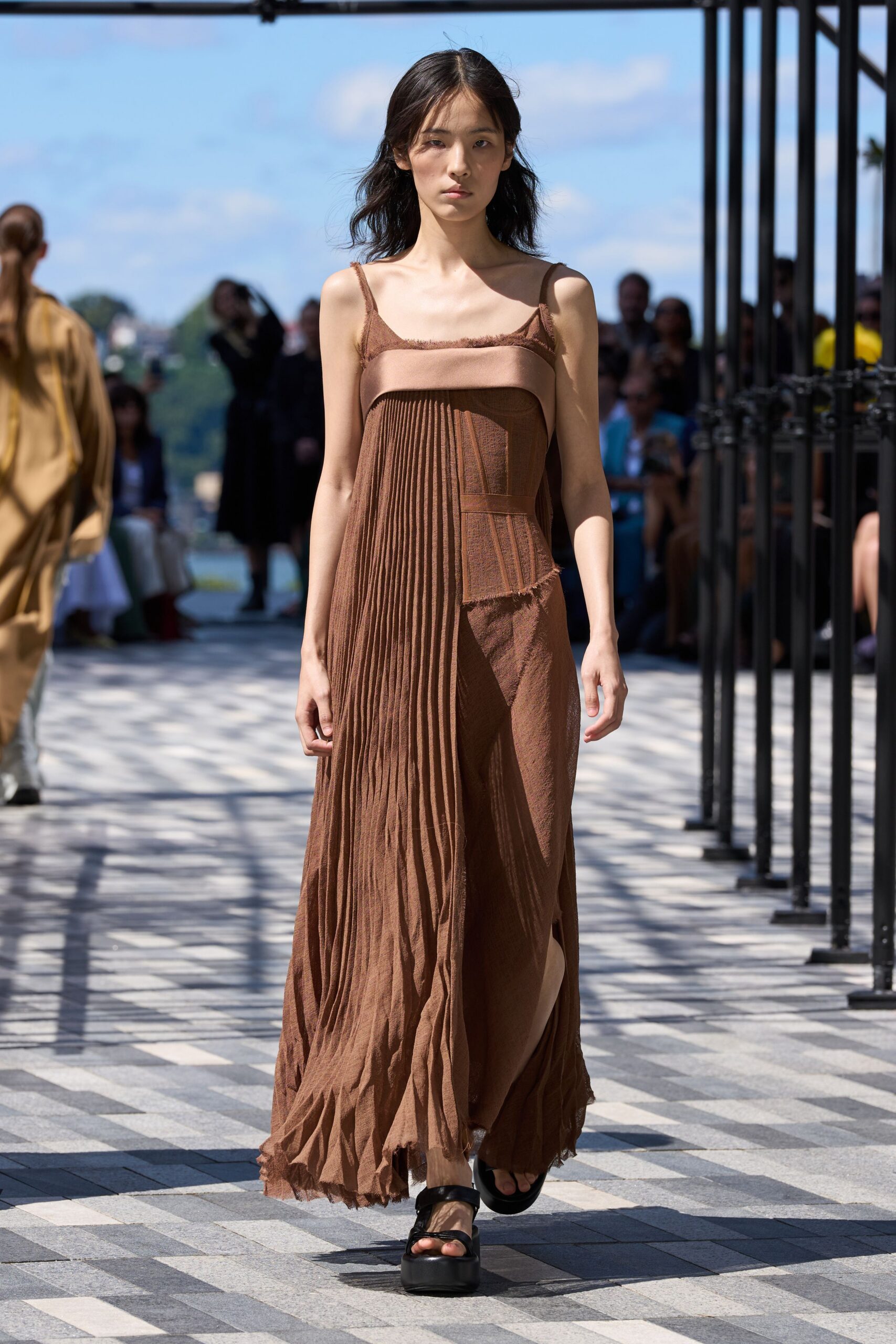 brown silk sleeveless v-neck fitted pleated flowing dress