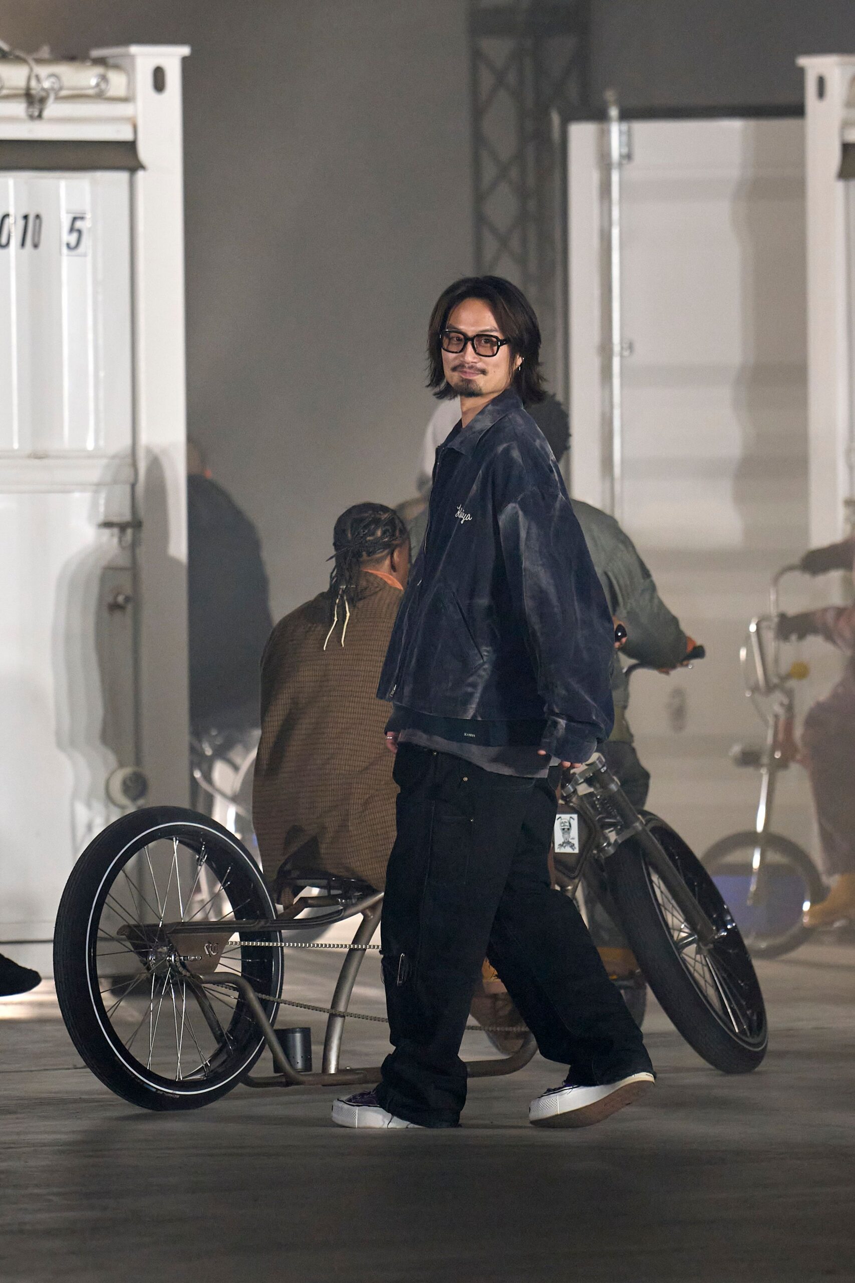 blue denim jacket black cargo pants white shoes